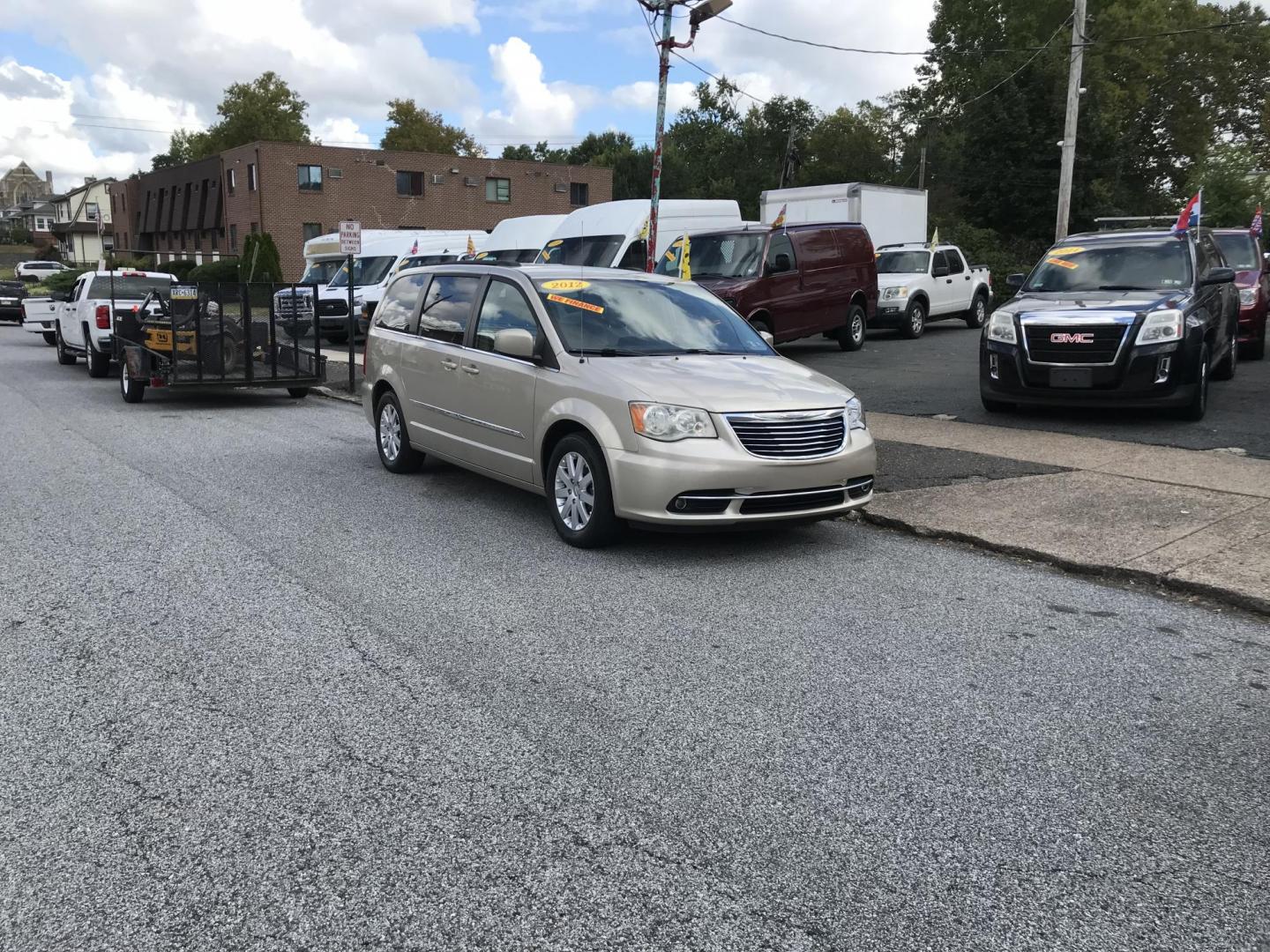 2012 Gold /Tan Chrysler Town & Country Touring (2C4RC1BG5CR) with an 3.6L V6 DOHC 24V engine, 6-Speed Automatic transmission, located at 577 Chester Pike, Prospect Park, PA, 19076, (610) 237-1015, 39.886154, -75.302338 - 2012 Chrysler Town & Country Touring: Navigation system, backup camera, stow and go seating, DVD player, new PA inspection, runs LIKE NEW! This vehicle comes inspected and has been given a bumper to bumper safety check. It is very clean, reliable, and well maintained. We offer a unique pay plan t - Photo#1