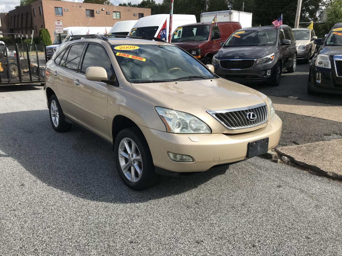 2009 Gold /Tan Lexus RX 350 AWD (2T2HK31UX9C) with an 3.5L V6 DOHC 24V engine, 5-Speed Automatic Overdrive transmission, located at 577 Chester Pike, Prospect Park, PA, 19076, (610) 237-1015, 39.886154, -75.302338 - 2009 Lexus RX 350 AWD: Navigation system, backup camera, sunroof, leather seats, runs EXCELLENT! We are selling this true mileage unknown. - Photo#0
