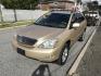 2009 Gold /Tan Lexus RX 350 AWD (2T2HK31UX9C) with an 3.5L V6 DOHC 24V engine, 5-Speed Automatic Overdrive transmission, located at 577 Chester Pike, Prospect Park, PA, 19076, (610) 237-1015, 39.886154, -75.302338 - 2009 Lexus RX 350 AWD: Navigation system, backup camera, sunroof, leather seats, runs EXCELLENT! We are selling this true mileage unknown. - Photo#1
