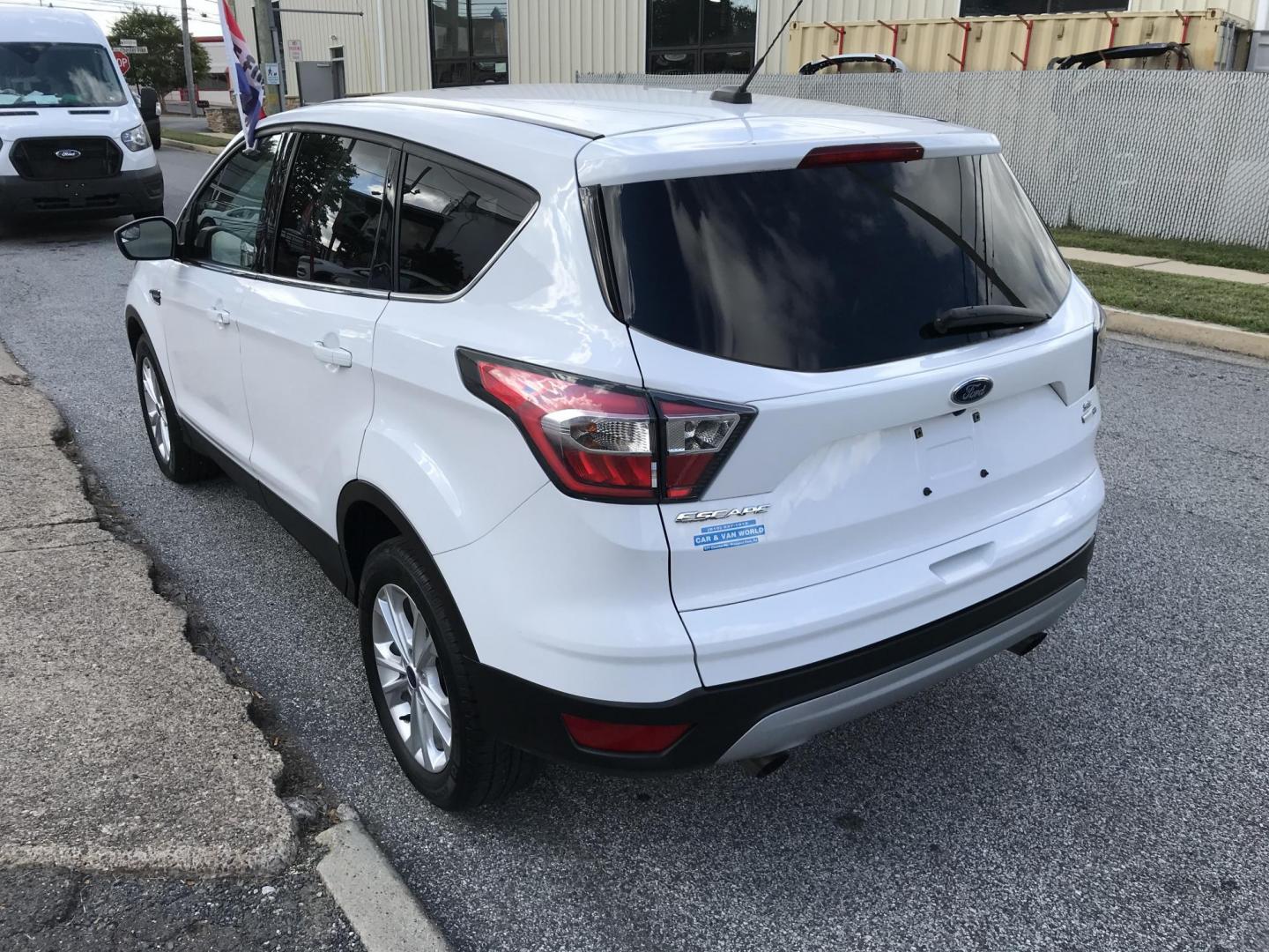 2017 White /Tan Ford Escape SE 4WD (1FMCU9GD6HU) with an 1.5L L4 DOHC 16V engine, 6A transmission, located at 577 Chester Pike, Prospect Park, PA, 19076, (610) 237-1015, 39.886154, -75.302338 - 2017 Ford Escape SE: Only 99k miles, backup camera, new PA inspection, SUPER CLEAN, runs LIKE NEW! This vehicle comes inspected and has been given a bumper to bumper safety check. It is very clean, reliable, and well maintained. We offer a unique pay plan that is known for being the easiest and f - Photo#5
