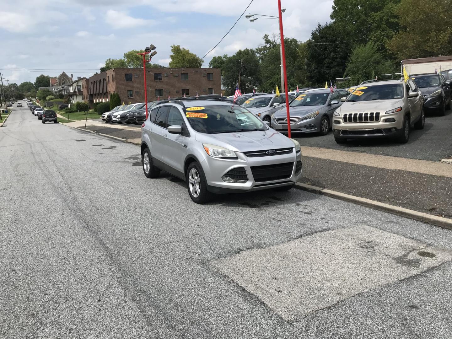 2013 Silver /Gray Ford Escape SE 4WD (1FMCU9G9XDU) with an 2.0L L4 DOHC 16V engine, 6-Speed Automatic transmission, located at 577 Chester Pike, Prospect Park, PA, 19076, (610) 237-1015, 39.886154, -75.302338 - 2013 Ford Escape SE: 4x4, new PA inspection, great on gas, SUPER CLEAN, runs LIKE NEW! This vehicle comes inspected and has been given a bumper to bumper safety check. It is very clean, reliable, and well maintained. We offer a unique pay plan that is known for being the easiest and fastest finan- Photo#1
