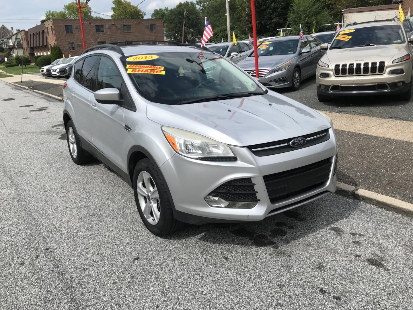 2013 Silver /Gray Ford Escape SE 4WD (1FMCU9G9XDU) with an 2.0L L4 DOHC 16V engine, 6-Speed Automatic transmission, located at 577 Chester Pike, Prospect Park, PA, 19076, (610) 237-1015, 39.886154, -75.302338 - 2013 Ford Escape SE: 4x4, new PA inspection, great on gas, SUPER CLEAN, runs LIKE NEW! This vehicle comes inspected and has been given a bumper to bumper safety check. It is very clean, reliable, and well maintained. We offer a unique pay plan that is known for being the easiest and fastest finan- Photo#2