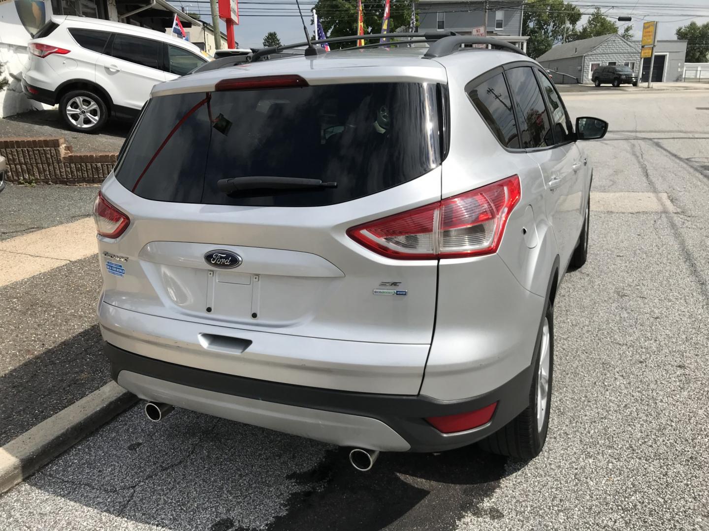2013 Silver /Gray Ford Escape SE 4WD (1FMCU9G9XDU) with an 2.0L L4 DOHC 16V engine, 6-Speed Automatic transmission, located at 577 Chester Pike, Prospect Park, PA, 19076, (610) 237-1015, 39.886154, -75.302338 - 2013 Ford Escape SE: 4x4, new PA inspection, great on gas, SUPER CLEAN, runs LIKE NEW! This vehicle comes inspected and has been given a bumper to bumper safety check. It is very clean, reliable, and well maintained. We offer a unique pay plan that is known for being the easiest and fastest finan- Photo#6