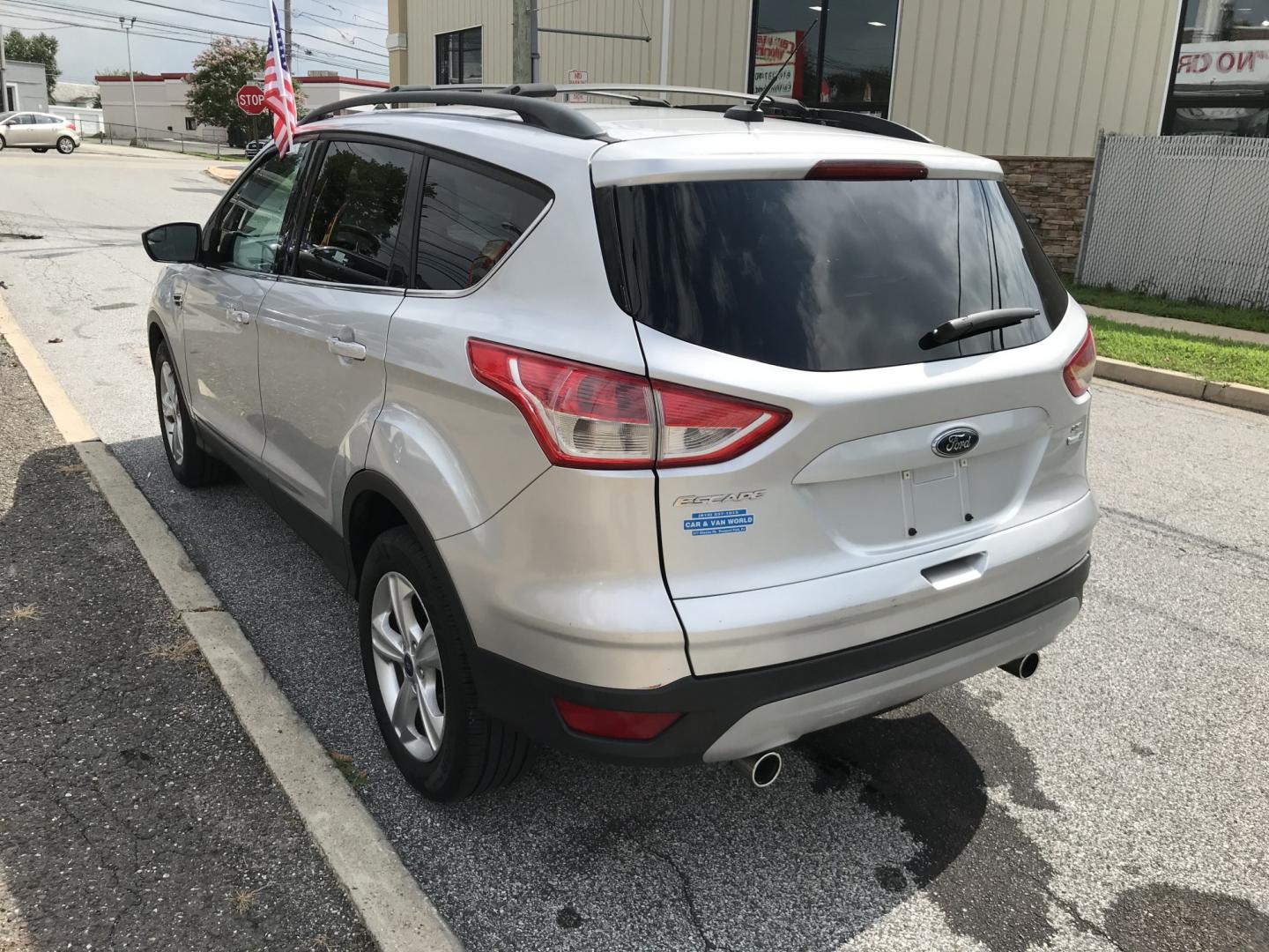 2013 Silver /Gray Ford Escape SE 4WD (1FMCU9G9XDU) with an 2.0L L4 DOHC 16V engine, 6-Speed Automatic transmission, located at 577 Chester Pike, Prospect Park, PA, 19076, (610) 237-1015, 39.886154, -75.302338 - 2013 Ford Escape SE: 4x4, new PA inspection, great on gas, SUPER CLEAN, runs LIKE NEW! This vehicle comes inspected and has been given a bumper to bumper safety check. It is very clean, reliable, and well maintained. We offer a unique pay plan that is known for being the easiest and fastest finan- Photo#5