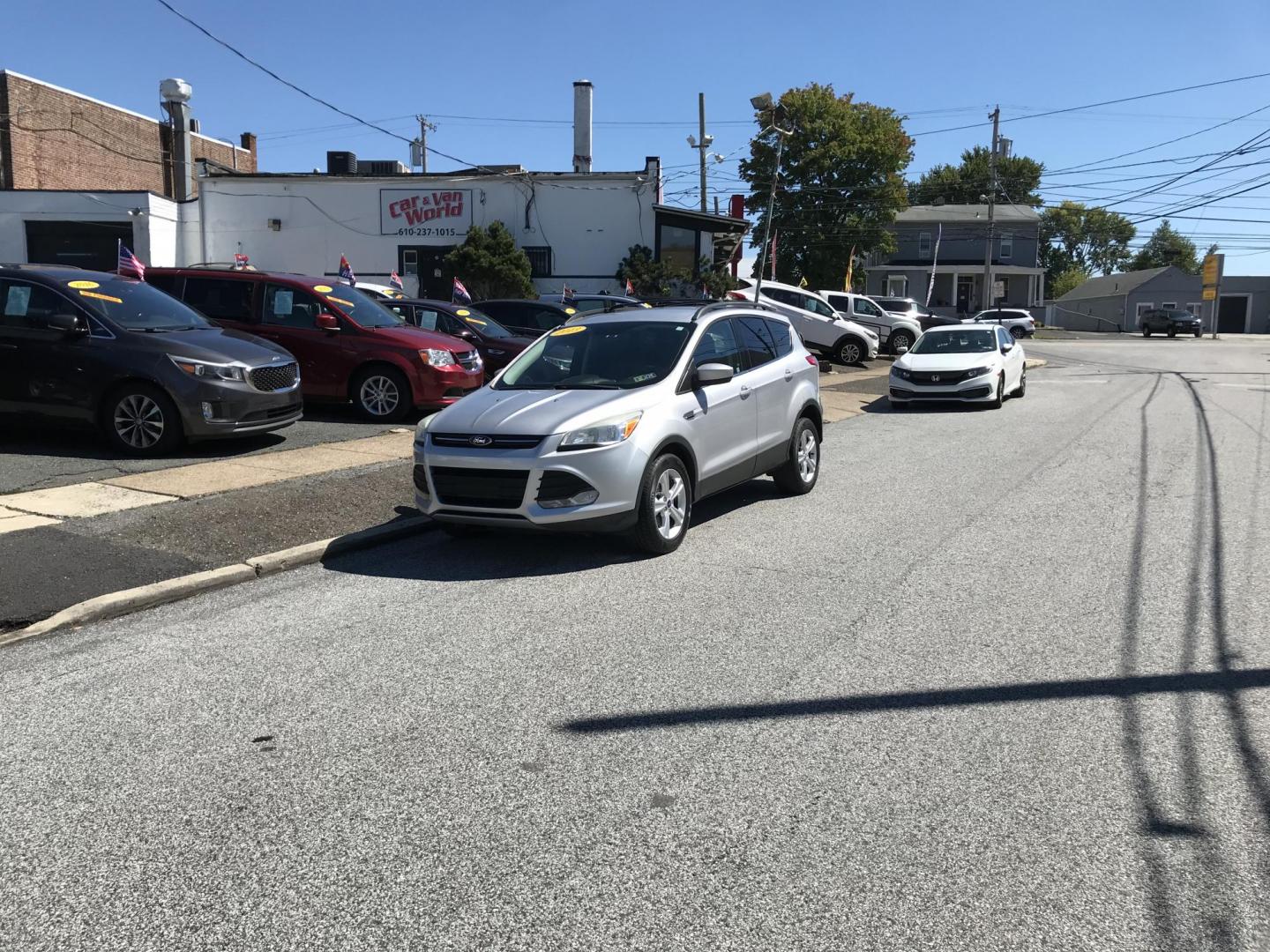 2013 Silver /Gray Ford Escape SE FWD (1FMCU0GX1DU) with an 1.6L L4 DOHC 16V engine, 6-Speed Automatic transmission, located at 577 Chester Pike, Prospect Park, PA, 19076, (610) 237-1015, 39.886154, -75.302338 - Photo#1