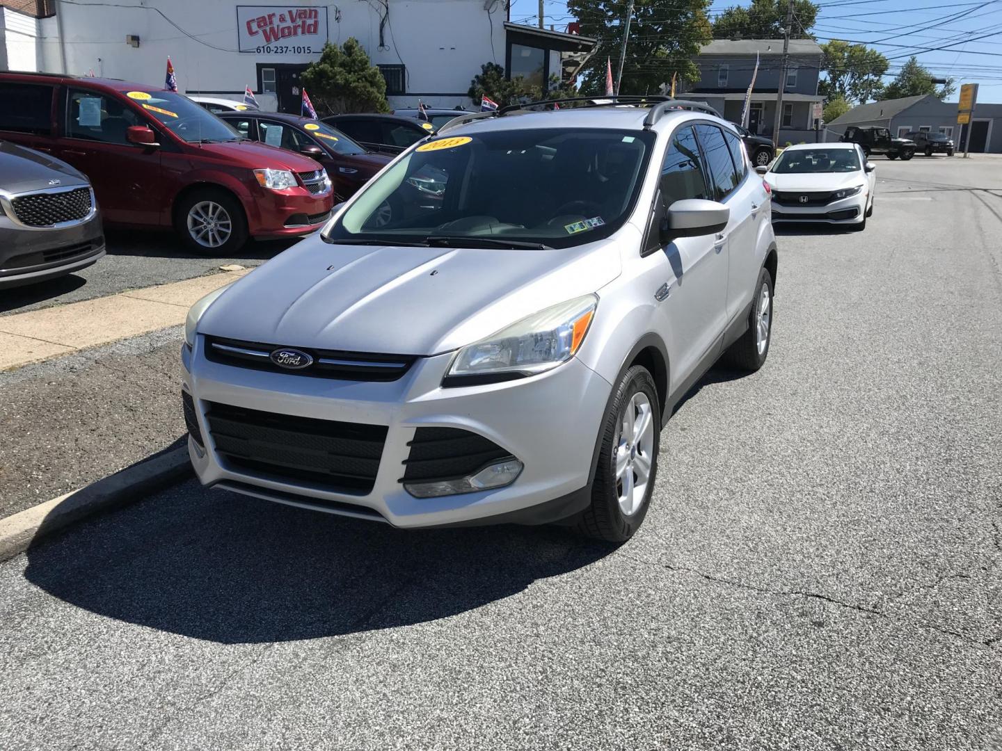 2013 Silver /Gray Ford Escape SE FWD (1FMCU0GX1DU) with an 1.6L L4 DOHC 16V engine, 6-Speed Automatic transmission, located at 577 Chester Pike, Prospect Park, PA, 19076, (610) 237-1015, 39.886154, -75.302338 - Photo#2