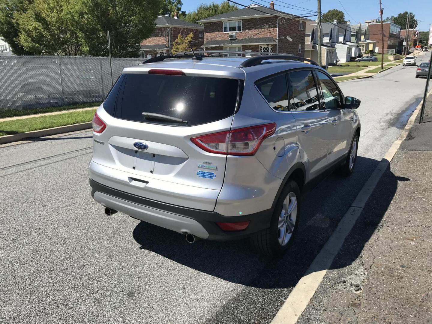 2013 Silver /Gray Ford Escape SE FWD (1FMCU0GX1DU) with an 1.6L L4 DOHC 16V engine, 6-Speed Automatic transmission, located at 577 Chester Pike, Prospect Park, PA, 19076, (610) 237-1015, 39.886154, -75.302338 - Photo#4
