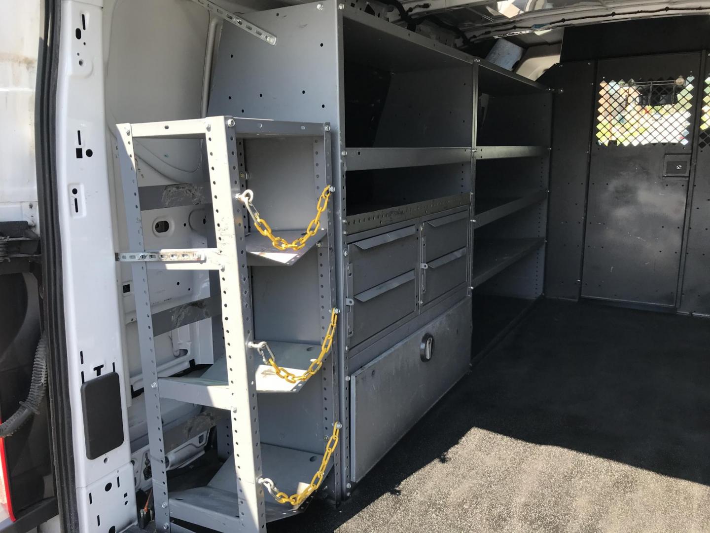2015 White /Gray Ford Transit 250 Van Low Roof 60/40 Pass.130-in. WB (1FTNR1ZM0FK) with an 3.7L V6 DOHC 24V engine, 6-Speed Automatic transmission, located at 577 Chester Pike, Prospect Park, PA, 19076, (610) 237-1015, 39.886154, -75.302338 - 2015 Ford Transit 250: Only 100k miles, multiple pieces of shelving, partition, no side or rear windows, FLEET MAINTAINED! This vehicle comes inspected and has been given a bumper to bumper safety check. It is very clean, reliable, and well maintained. We offer a unique pay plan that is known for - Photo#18
