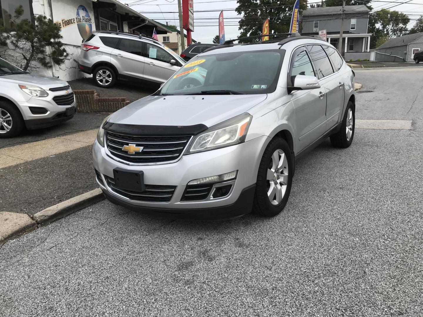 2013 Silver /Black Chevrolet Traverse LTZ AWD (1GNKVLKD3DJ) with an 3.6L V6 DOHC 24V engine, 6-Speed Automatic transmission, located at 577 Chester Pike, Prospect Park, PA, 19076, (610) 237-1015, 39.886154, -75.302338 - Photo#2