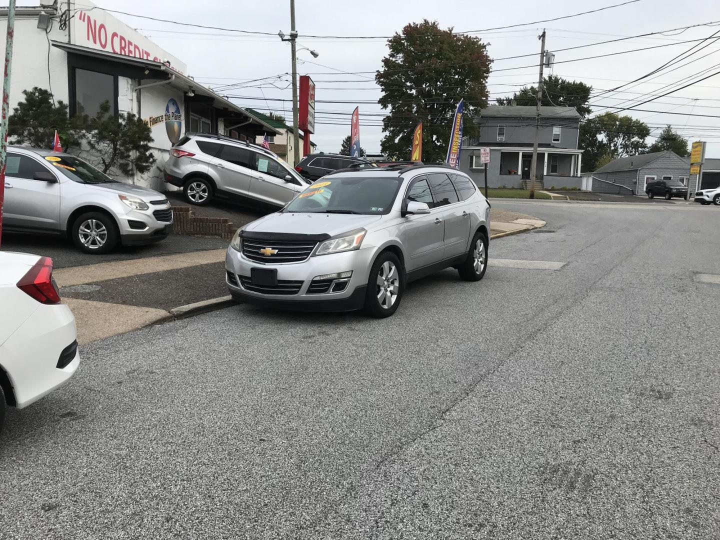 2013 Silver /Black Chevrolet Traverse LTZ AWD (1GNKVLKD3DJ) with an 3.6L V6 DOHC 24V engine, 6-Speed Automatic transmission, located at 577 Chester Pike, Prospect Park, PA, 19076, (610) 237-1015, 39.886154, -75.302338 - Photo#1