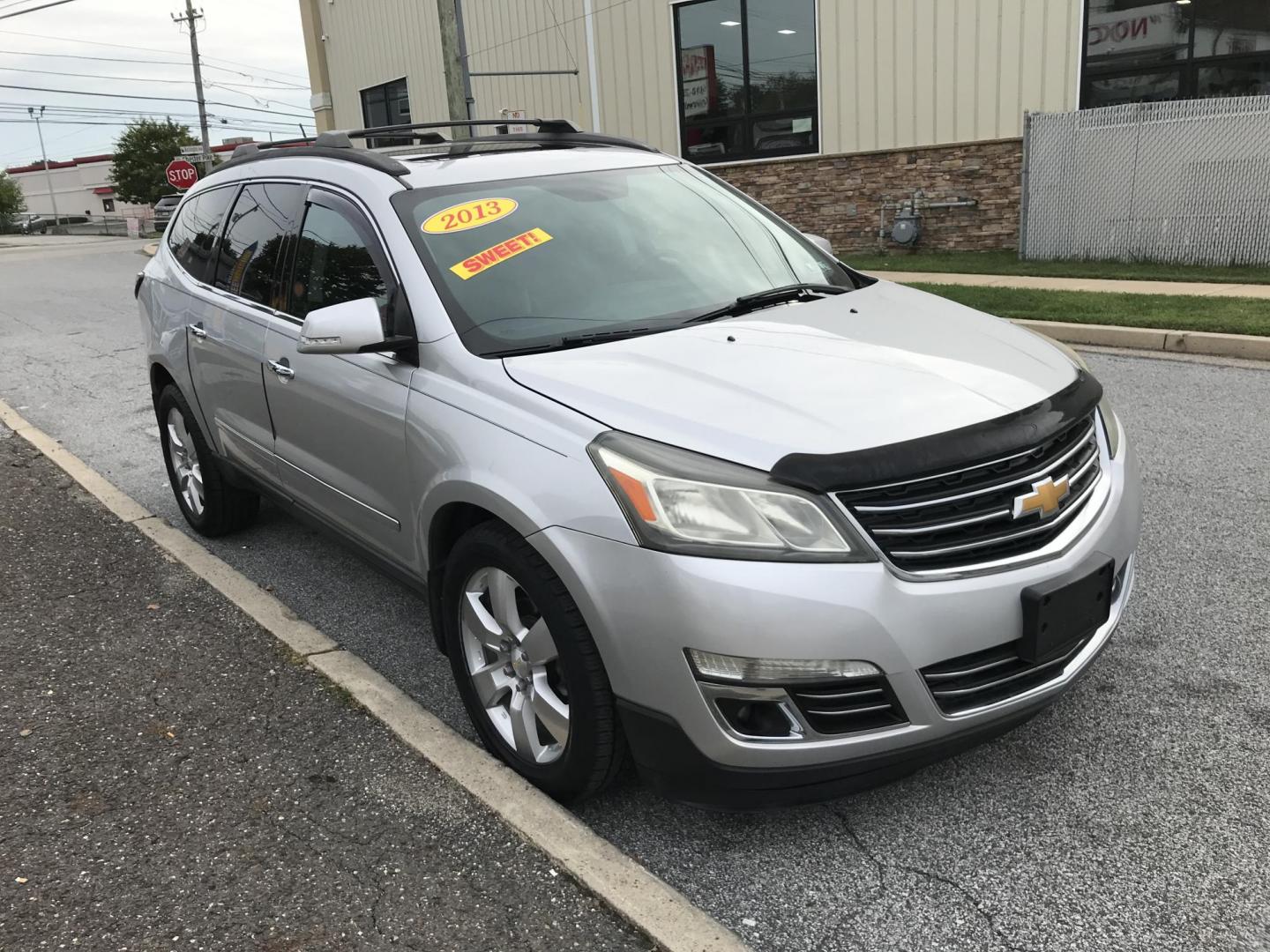 2013 Silver /Black Chevrolet Traverse LTZ AWD (1GNKVLKD3DJ) with an 3.6L V6 DOHC 24V engine, 6-Speed Automatic transmission, located at 577 Chester Pike, Prospect Park, PA, 19076, (610) 237-1015, 39.886154, -75.302338 - Photo#3