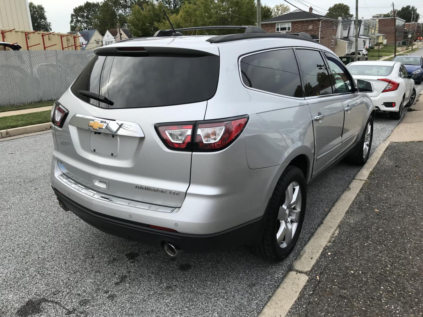 2013 Silver /Black Chevrolet Traverse LTZ AWD (1GNKVLKD3DJ) with an 3.6L V6 DOHC 24V engine, 6-Speed Automatic transmission, located at 577 Chester Pike, Prospect Park, PA, 19076, (610) 237-1015, 39.886154, -75.302338 - Photo#4