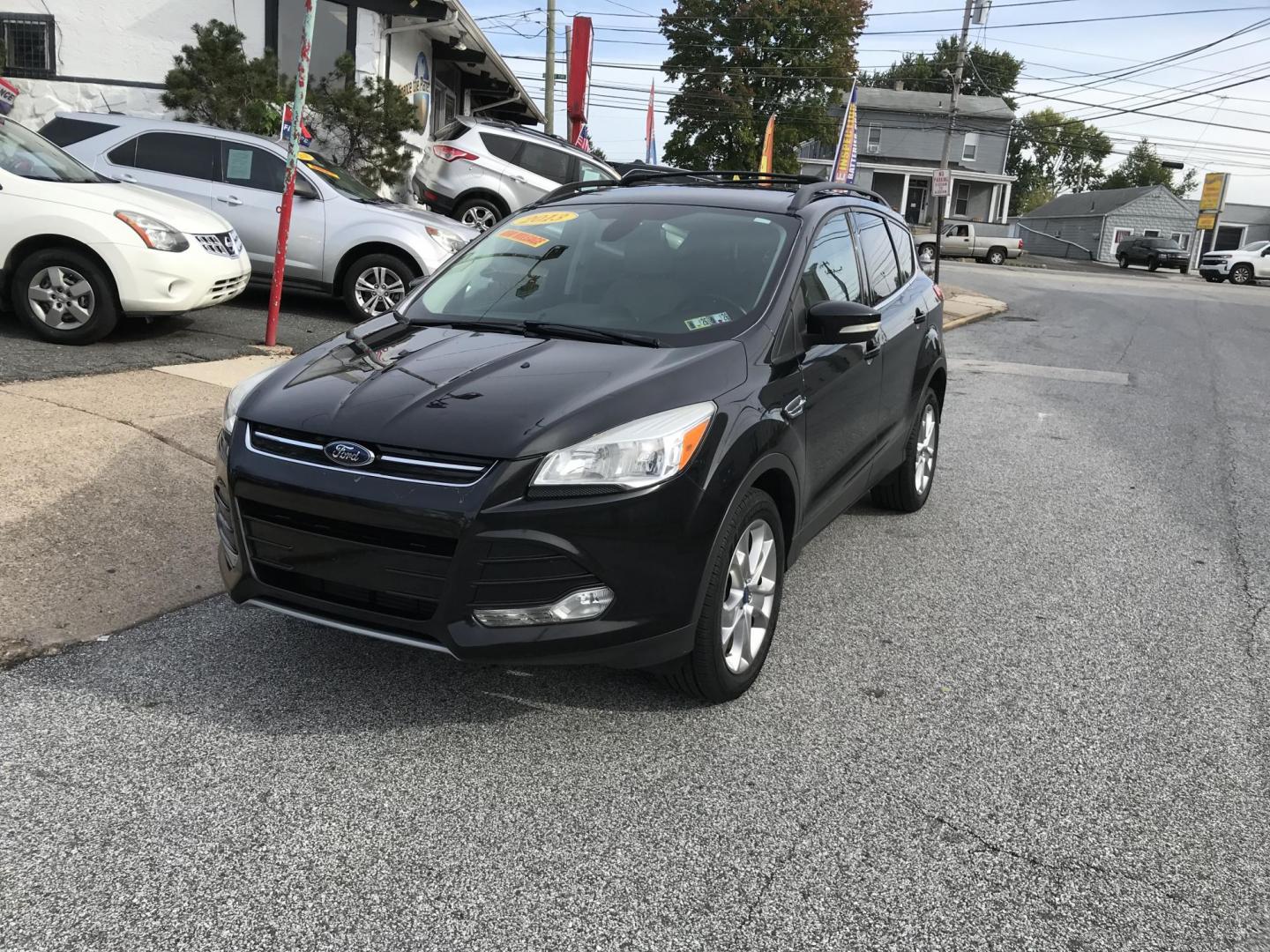 2013 Black /Tan Ford Escape SEL 4WD (1FMCU9H98DU) with an 2.0L L4 DOHC 16V engine, 6-Speed Automatic transmission, located at 577 Chester Pike, Prospect Park, PA, 19076, (610) 237-1015, 39.886154, -75.302338 - Photo#2