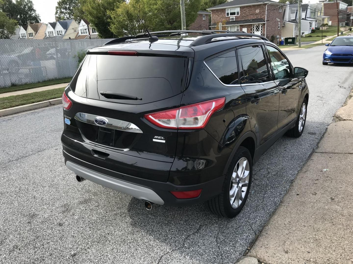 2013 Black /Tan Ford Escape SEL 4WD (1FMCU9H98DU) with an 2.0L L4 DOHC 16V engine, 6-Speed Automatic transmission, located at 577 Chester Pike, Prospect Park, PA, 19076, (610) 237-1015, 39.886154, -75.302338 - Photo#3