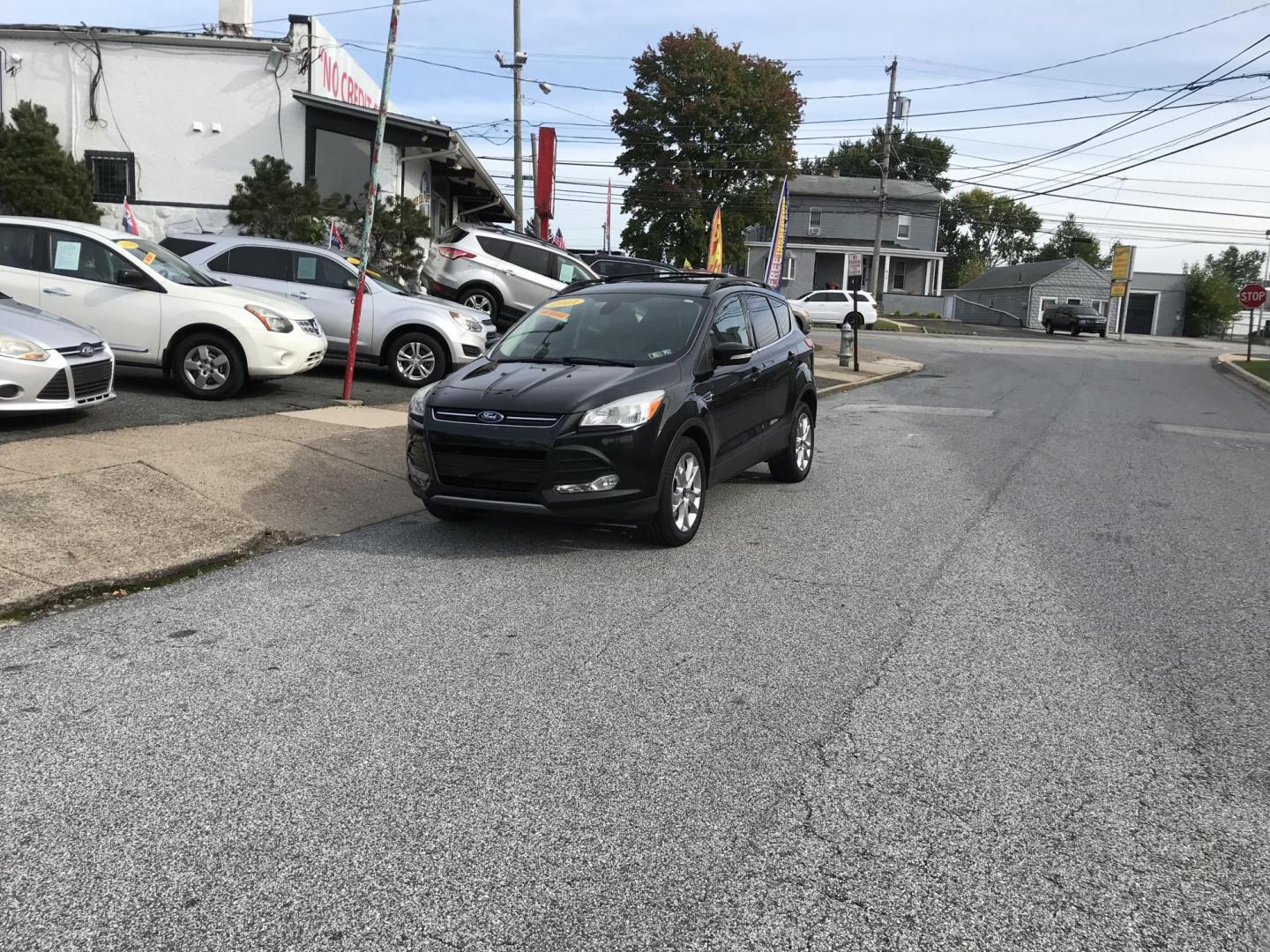 2013 Black /Tan Ford Escape SEL 4WD (1FMCU9H98DU) with an 2.0L L4 DOHC 16V engine, 6-Speed Automatic transmission, located at 577 Chester Pike, Prospect Park, PA, 19076, (610) 237-1015, 39.886154, -75.302338 - Photo#1