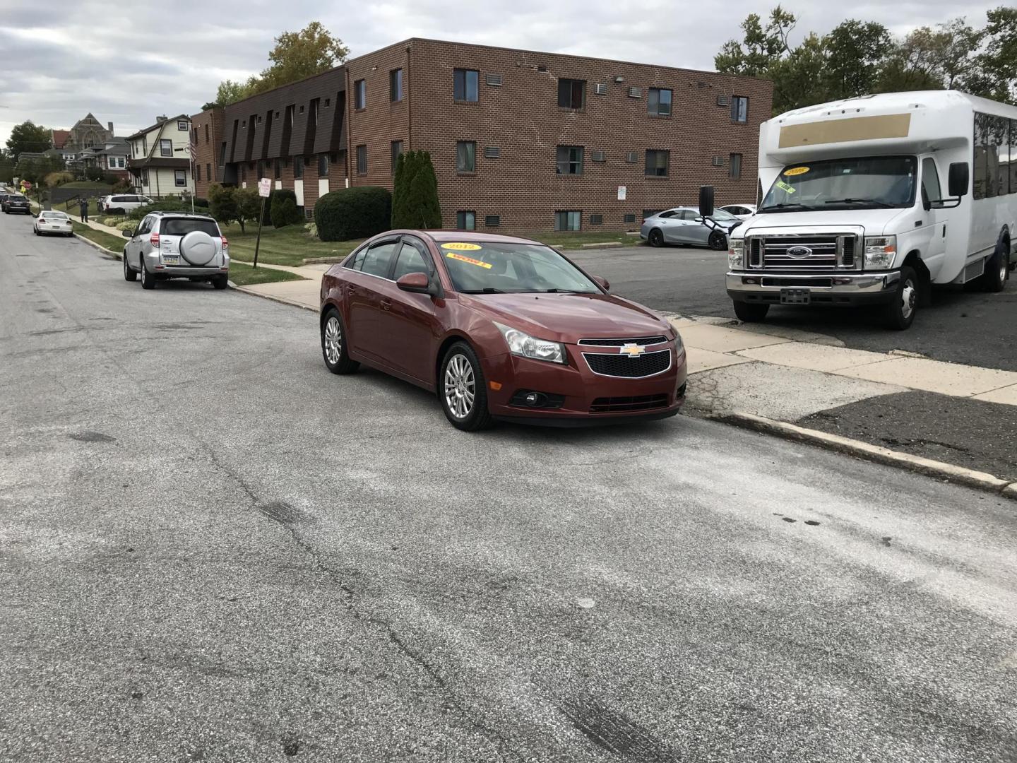 2012 Orange /Gray Chevrolet Cruze Eco (1G1PJ5SC7C7) with an 1.4L L4 DOHC 16V TURBO engine, 6-Speed Automatic transmission, located at 577 Chester Pike, Prospect Park, PA, 19076, (610) 237-1015, 39.886154, -75.302338 - 2012 Chevy Cruze: Only 135k miles, great on gas, new PA inspection, SUPER CLEAN, runs LIKE NEW! This vehicle comes inspected and has been given a bumper to bumper safety check. It is very clean, reliable, and well maintained. We offer a unique pay plan that is known for being the easiest and fast - Photo#1