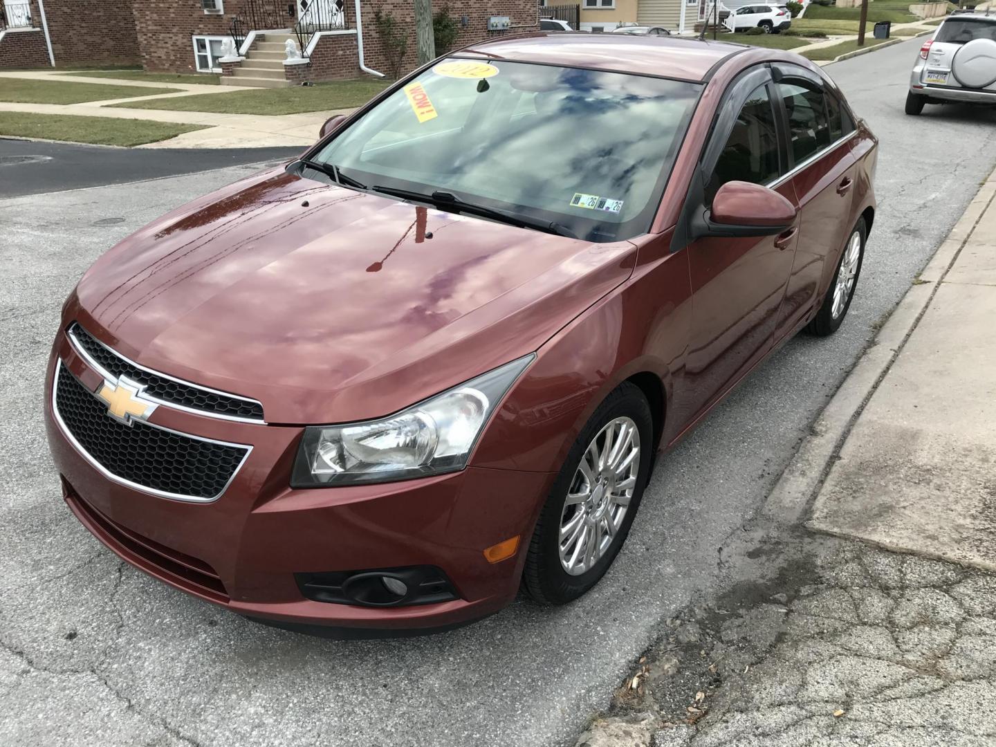 2012 Orange /Gray Chevrolet Cruze Eco (1G1PJ5SC7C7) with an 1.4L L4 DOHC 16V TURBO engine, 6-Speed Automatic transmission, located at 577 Chester Pike, Prospect Park, PA, 19076, (610) 237-1015, 39.886154, -75.302338 - 2012 Chevy Cruze: Only 135k miles, great on gas, new PA inspection, SUPER CLEAN, runs LIKE NEW! This vehicle comes inspected and has been given a bumper to bumper safety check. It is very clean, reliable, and well maintained. We offer a unique pay plan that is known for being the easiest and fast - Photo#3