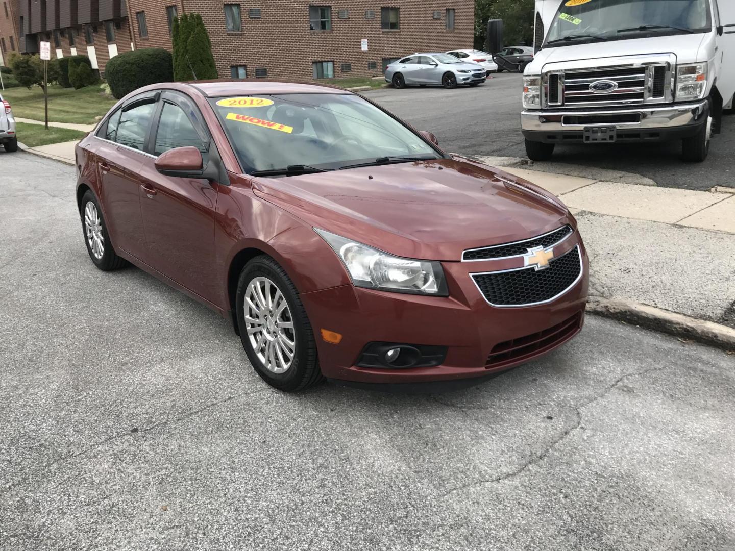 2012 Orange /Gray Chevrolet Cruze Eco (1G1PJ5SC7C7) with an 1.4L L4 DOHC 16V TURBO engine, 6-Speed Automatic transmission, located at 577 Chester Pike, Prospect Park, PA, 19076, (610) 237-1015, 39.886154, -75.302338 - 2012 Chevy Cruze: Only 135k miles, great on gas, new PA inspection, SUPER CLEAN, runs LIKE NEW! This vehicle comes inspected and has been given a bumper to bumper safety check. It is very clean, reliable, and well maintained. We offer a unique pay plan that is known for being the easiest and fast - Photo#2