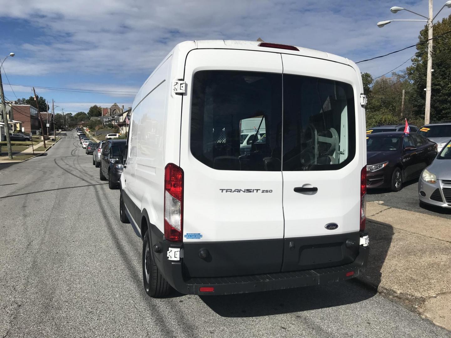 2016 White /Gray Ford Transit 250 Van Med. Roof w/Sliding Pass. 148-in. WB (1FTYR2CM1GK) with an 3.7L V6 DOHC 24V engine, 6-Speed Automatic transmission, located at 577 Chester Pike, Prospect Park, PA, 19076, (610) 237-1015, 39.886154, -75.302338 - 2016 Ford Transit 250 Medium Roof: Has multiple pieces of shelving, partition, new PA inspection, FLEET MAINTAINED, runs LIKE NEW! This vehicle comes inspected and has been given a bumper to bumper safety check. It is very clean, reliable, and well maintained. We offer a unique pay plan that is k - Photo#5
