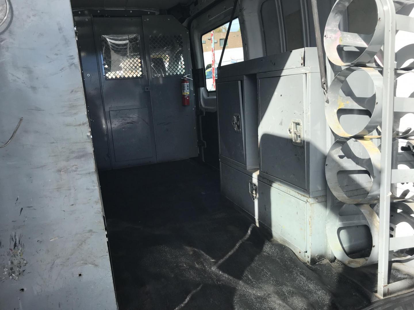 2016 White /Gray Ford Transit 250 Van Med. Roof w/Sliding Pass. 148-in. WB (1FTYR2CM1GK) with an 3.7L V6 DOHC 24V engine, 6-Speed Automatic transmission, located at 577 Chester Pike, Prospect Park, PA, 19076, (610) 237-1015, 39.886154, -75.302338 - 2016 Ford Transit 250 Medium Roof: Has multiple pieces of shelving, partition, new PA inspection, FLEET MAINTAINED, runs LIKE NEW! This vehicle comes inspected and has been given a bumper to bumper safety check. It is very clean, reliable, and well maintained. We offer a unique pay plan that is k - Photo#17