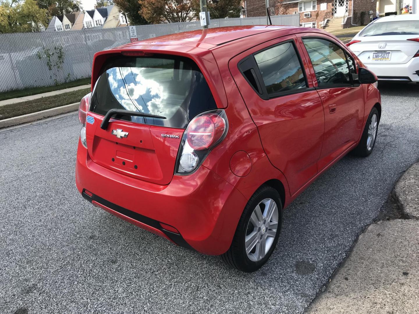 2014 Red /Black Chevrolet Spark LS Auto (KL8CB6S90EC) with an 1.2L L4 16V DOHC engine, Continuously Variable Transmission transmission, located at 577 Chester Pike, Prospect Park, PA, 19076, (610) 237-1015, 39.886154, -75.302338 - 2014 Chevy Spark LS: Only 76k miles, new PA inspection, great on gas, runs LIKE NEW! This vehicle comes inspected and has been given a bumper to bumper safety check. It is very clean, reliable, and well maintained. We offer a unique pay plan that is known for being the easiest and fastest financi - Photo#4