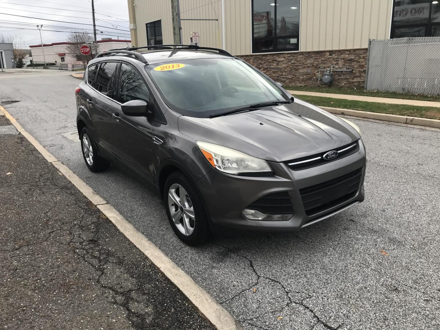 2013 Gray /Gray Ford Escape SE FWD (1FMCU0G95DU) with an 2.0L L4 DOHC 16V engine, 6-Speed Automatic transmission, located at 577 Chester Pike, Prospect Park, PA, 19076, (610) 237-1015, 39.886154, -75.302338 - 2013 Ford Escape: Only 125k miles, great on gas, new PA inspection, SUPER CLEAN, runs LIKE NEW! This vehicle comes inspected and has been given a bumper to bumper safety check. It is very clean, reliable, and well maintained. We offer a unique pay plan that is known for being the easiest and fast - Photo#3