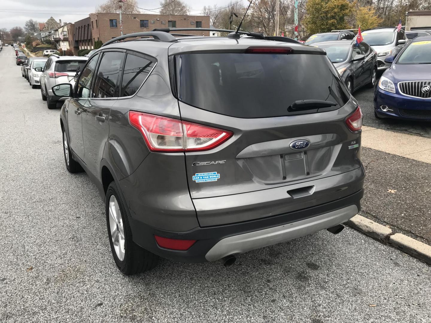 2013 Gray /Gray Ford Escape SE FWD (1FMCU0G95DU) with an 2.0L L4 DOHC 16V engine, 6-Speed Automatic transmission, located at 577 Chester Pike, Prospect Park, PA, 19076, (610) 237-1015, 39.886154, -75.302338 - 2013 Ford Escape: Only 125k miles, great on gas, new PA inspection, SUPER CLEAN, runs LIKE NEW! This vehicle comes inspected and has been given a bumper to bumper safety check. It is very clean, reliable, and well maintained. We offer a unique pay plan that is known for being the easiest and fast - Photo#5
