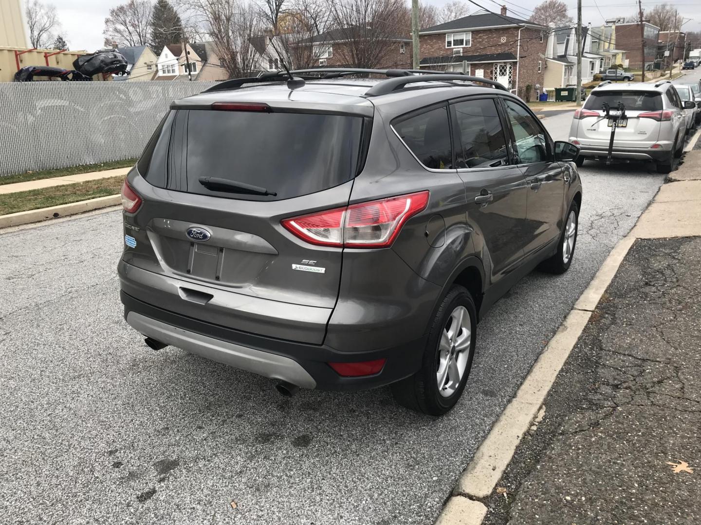 2013 Gray /Gray Ford Escape SE FWD (1FMCU0G95DU) with an 2.0L L4 DOHC 16V engine, 6-Speed Automatic transmission, located at 577 Chester Pike, Prospect Park, PA, 19076, (610) 237-1015, 39.886154, -75.302338 - 2013 Ford Escape: Only 125k miles, great on gas, new PA inspection, SUPER CLEAN, runs LIKE NEW! This vehicle comes inspected and has been given a bumper to bumper safety check. It is very clean, reliable, and well maintained. We offer a unique pay plan that is known for being the easiest and fast - Photo#4