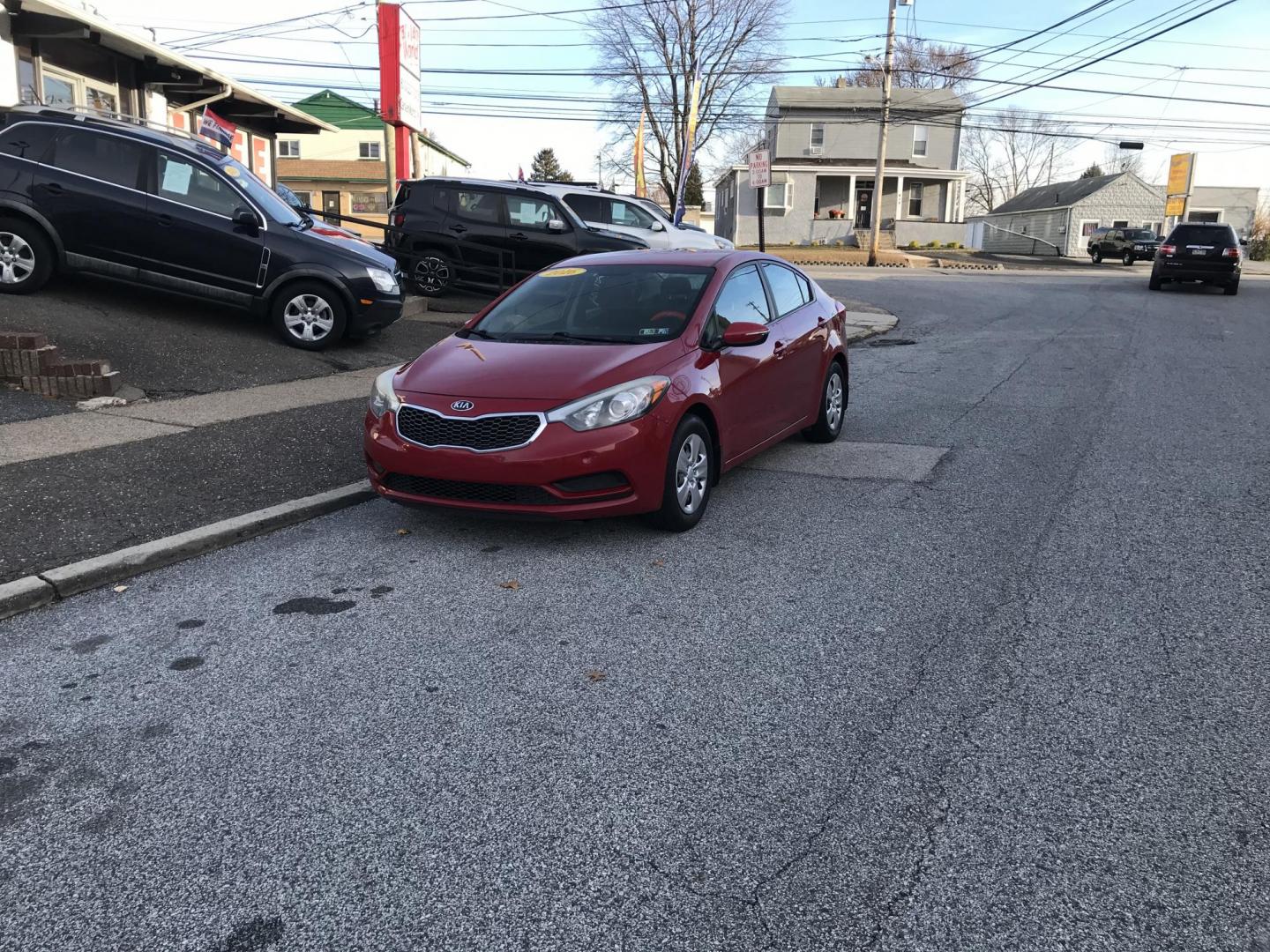 2016 Red /Gray Kia Forte EX (KNAFX4A64G5) with an 1.8L L4 DOHC 16V engine, 6-Speed Automatic transmission, located at 577 Chester Pike, Prospect Park, PA, 19076, (610) 237-1015, 39.886154, -75.302338 - Photo#1