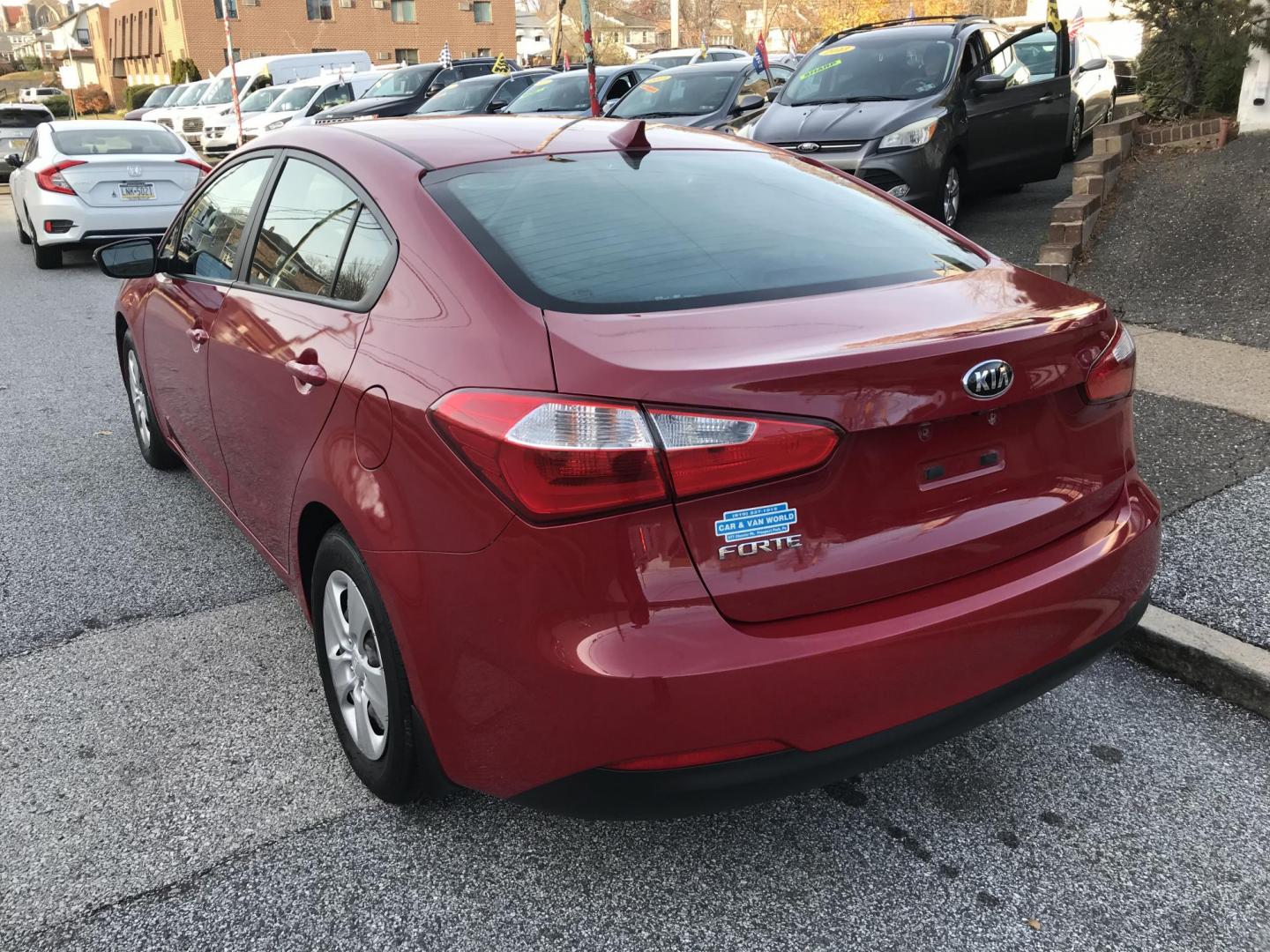 2016 Red /Gray Kia Forte EX (KNAFX4A64G5) with an 1.8L L4 DOHC 16V engine, 6-Speed Automatic transmission, located at 577 Chester Pike, Prospect Park, PA, 19076, (610) 237-1015, 39.886154, -75.302338 - Photo#5