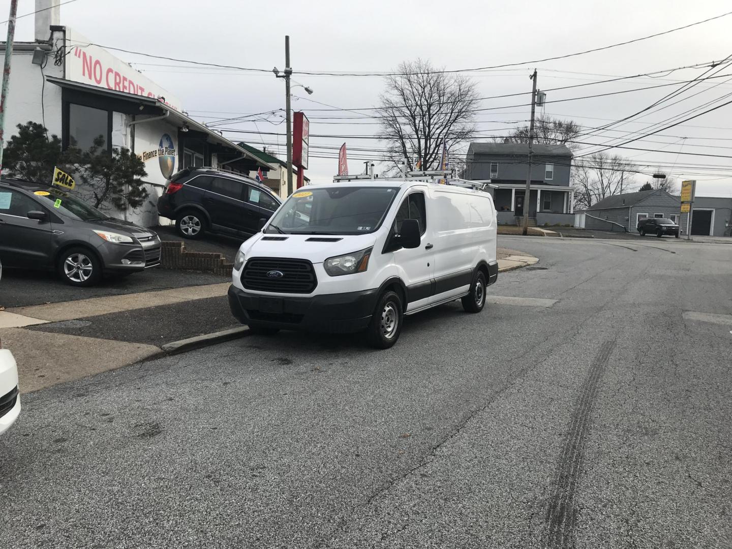 2017 White /Gray Ford Transit 150 Van Low Roof w/Sliding Pass. 130-in. WB (1FTYE1YM2HK) with an 3.7L V6 DOHC 24V engine, 6A transmission, located at 577 Chester Pike, Prospect Park, PA, 19076, (610) 237-1015, 39.886154, -75.302338 - 2017 Ford Transit 150: Double drop down ladder racks, shelving, backup camera, partition, new PA inspection, FLEET MAINTAINED, runs LIKE NEW! This vehicle comes inspected and has been given a bumper to bumper safety check. It is very clean, reliable, and well maintained. We offer a unique pay pla - Photo#1