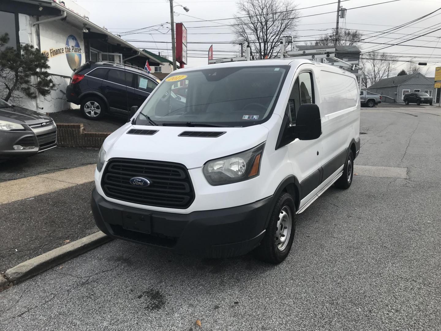 2017 White /Gray Ford Transit 150 Van Low Roof w/Sliding Pass. 130-in. WB (1FTYE1YM2HK) with an 3.7L V6 DOHC 24V engine, 6A transmission, located at 577 Chester Pike, Prospect Park, PA, 19076, (610) 237-1015, 39.886154, -75.302338 - 2017 Ford Transit 150: Double drop down ladder racks, shelving, backup camera, partition, new PA inspection, FLEET MAINTAINED, runs LIKE NEW! This vehicle comes inspected and has been given a bumper to bumper safety check. It is very clean, reliable, and well maintained. We offer a unique pay pla - Photo#2