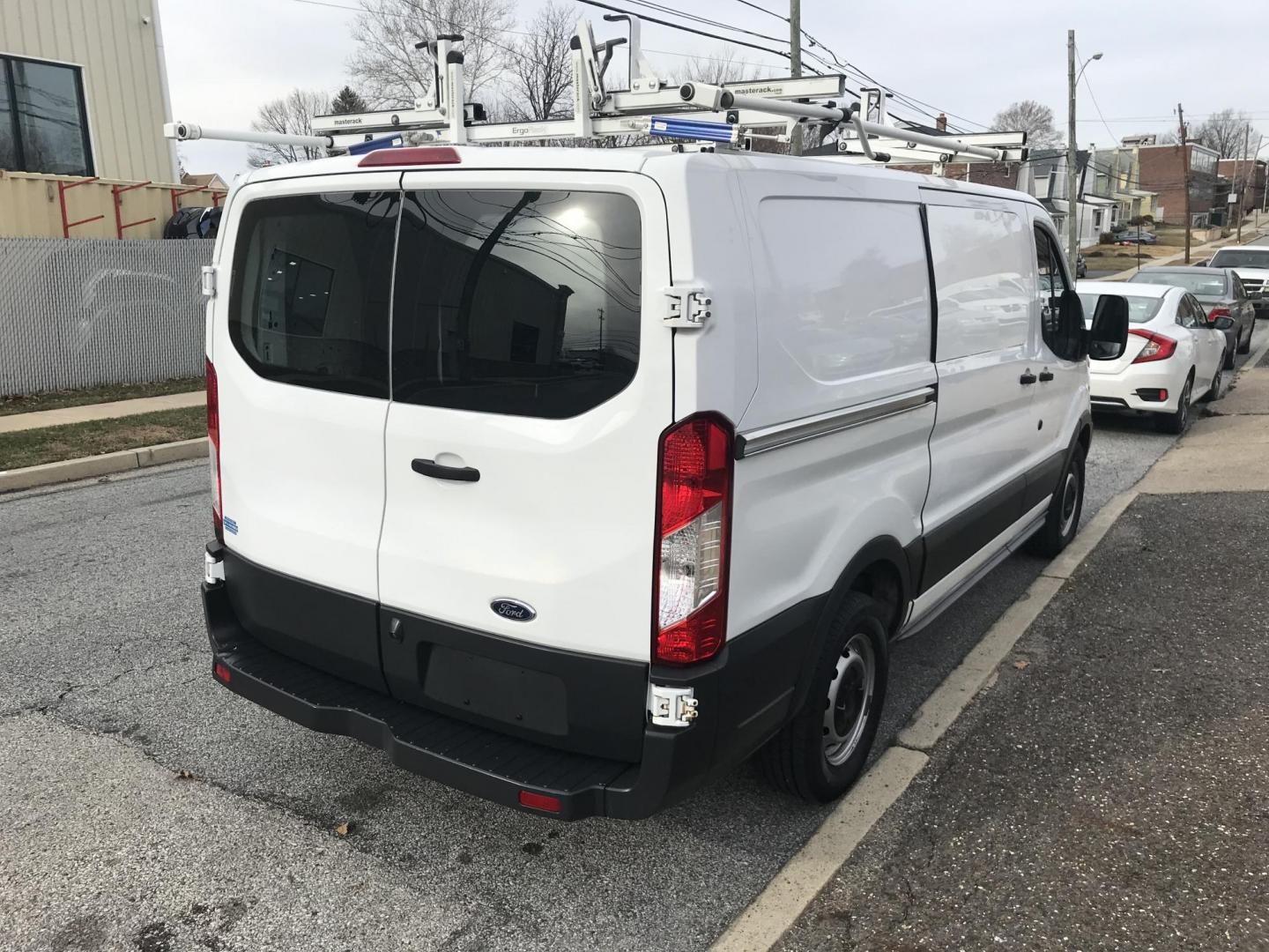 2017 White /Gray Ford Transit 150 Van Low Roof w/Sliding Pass. 130-in. WB (1FTYE1YM2HK) with an 3.7L V6 DOHC 24V engine, 6A transmission, located at 577 Chester Pike, Prospect Park, PA, 19076, (610) 237-1015, 39.886154, -75.302338 - 2017 Ford Transit 150: Double drop down ladder racks, shelving, backup camera, partition, new PA inspection, FLEET MAINTAINED, runs LIKE NEW! This vehicle comes inspected and has been given a bumper to bumper safety check. It is very clean, reliable, and well maintained. We offer a unique pay pla - Photo#4