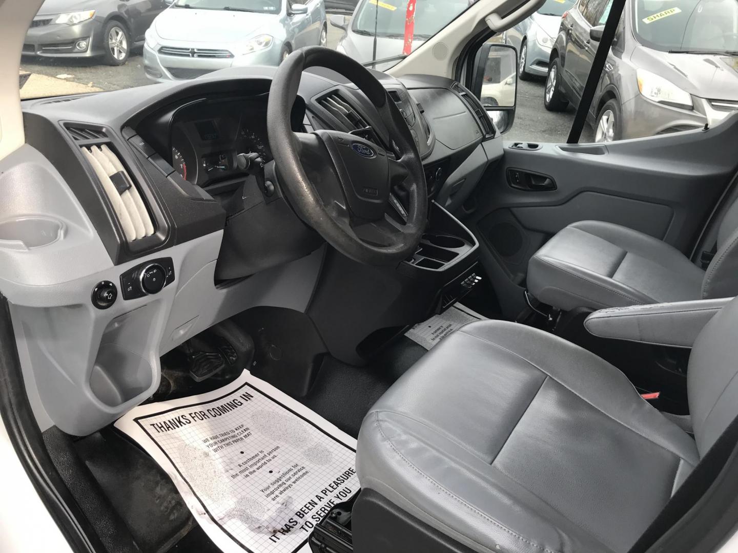 2017 White /Gray Ford Transit 150 Van Low Roof w/Sliding Pass. 130-in. WB (1FTYE1YM2HK) with an 3.7L V6 DOHC 24V engine, 6A transmission, located at 577 Chester Pike, Prospect Park, PA, 19076, (610) 237-1015, 39.886154, -75.302338 - 2017 Ford Transit 150: Double drop down ladder racks, shelving, backup camera, partition, new PA inspection, FLEET MAINTAINED, runs LIKE NEW! This vehicle comes inspected and has been given a bumper to bumper safety check. It is very clean, reliable, and well maintained. We offer a unique pay pla - Photo#7