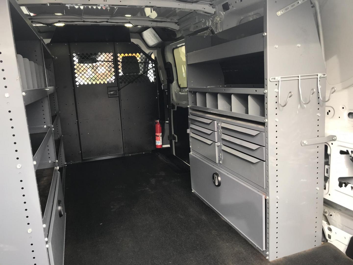 2017 White /Gray Ford Transit 150 Van Low Roof w/Sliding Pass. 130-in. WB (1FTYE1YM2HK) with an 3.7L V6 DOHC 24V engine, 6A transmission, located at 577 Chester Pike, Prospect Park, PA, 19076, (610) 237-1015, 39.886154, -75.302338 - 2017 Ford Transit 150: Double drop down ladder racks, shelving, backup camera, partition, new PA inspection, FLEET MAINTAINED, runs LIKE NEW! This vehicle comes inspected and has been given a bumper to bumper safety check. It is very clean, reliable, and well maintained. We offer a unique pay pla - Photo#17