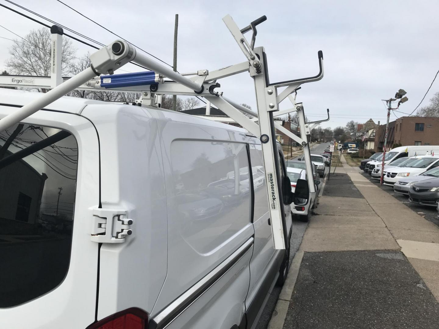 2017 White /Gray Ford Transit 150 Van Low Roof w/Sliding Pass. 130-in. WB (1FTYE1YM2HK) with an 3.7L V6 DOHC 24V engine, 6A transmission, located at 577 Chester Pike, Prospect Park, PA, 19076, (610) 237-1015, 39.886154, -75.302338 - 2017 Ford Transit 150: Double drop down ladder racks, shelving, backup camera, partition, new PA inspection, FLEET MAINTAINED, runs LIKE NEW! This vehicle comes inspected and has been given a bumper to bumper safety check. It is very clean, reliable, and well maintained. We offer a unique pay pla - Photo#19