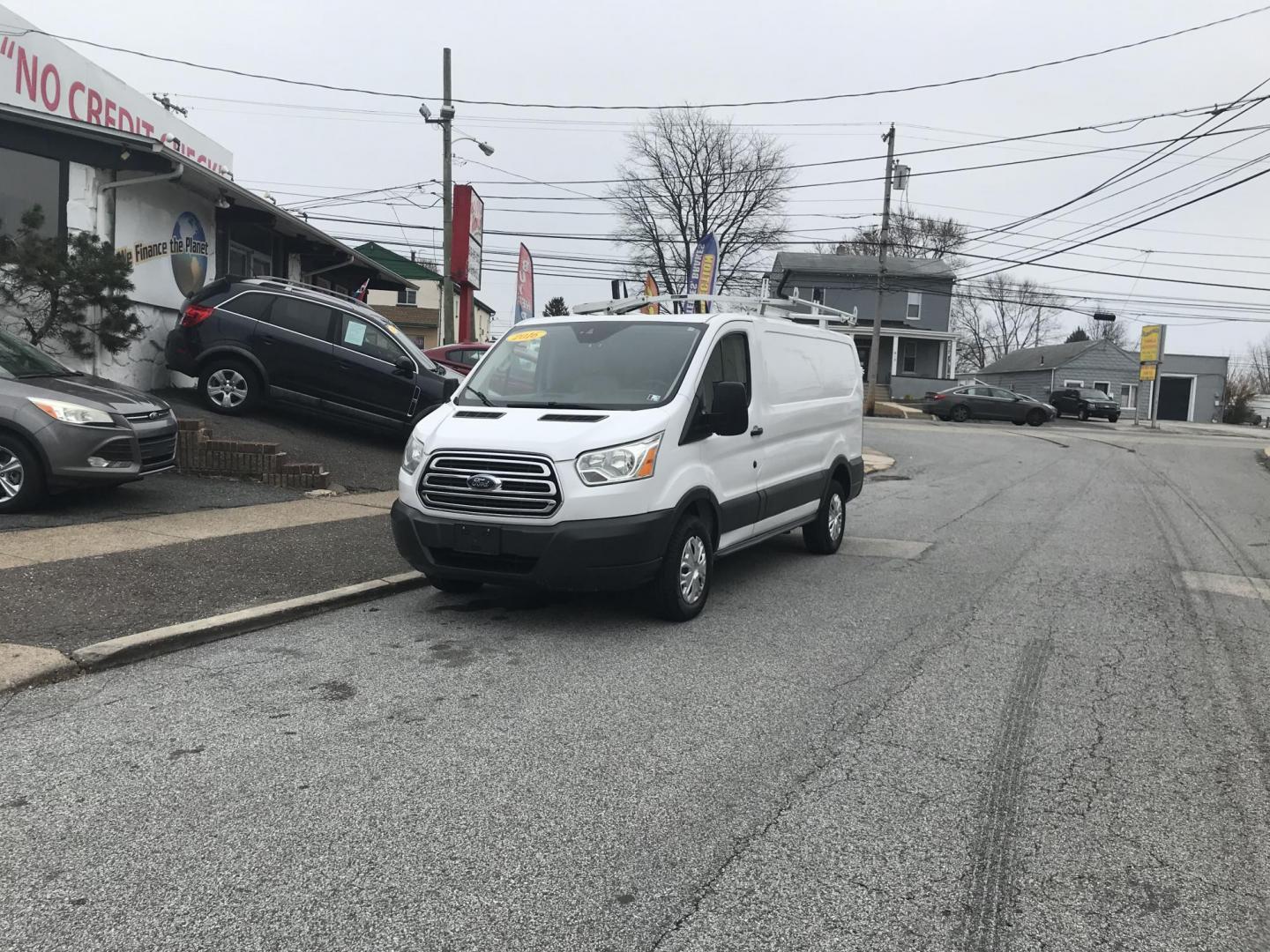 2016 White /Gray Ford Transit 250 Van Low Roof 60/40 Pass.130-in. WB (1FTYR1ZM6GK) with an 3.7L V6 DOHC 24V engine, 6A transmission, located at 577 Chester Pike, Prospect Park, PA, 19076, (610) 237-1015, 39.886154, -75.302338 - 2016 Ford Transit 250 Low Roof: Ladder racks, shelving, no side or rear windows, partition, new PA inspection, FLEET MAINTAINED, runs LIKE NEW! This vehicle comes inspected and has been given a bumper to bumper safety check. It is very clean, reliable, and well maintained. We offer a unique pay p - Photo#1