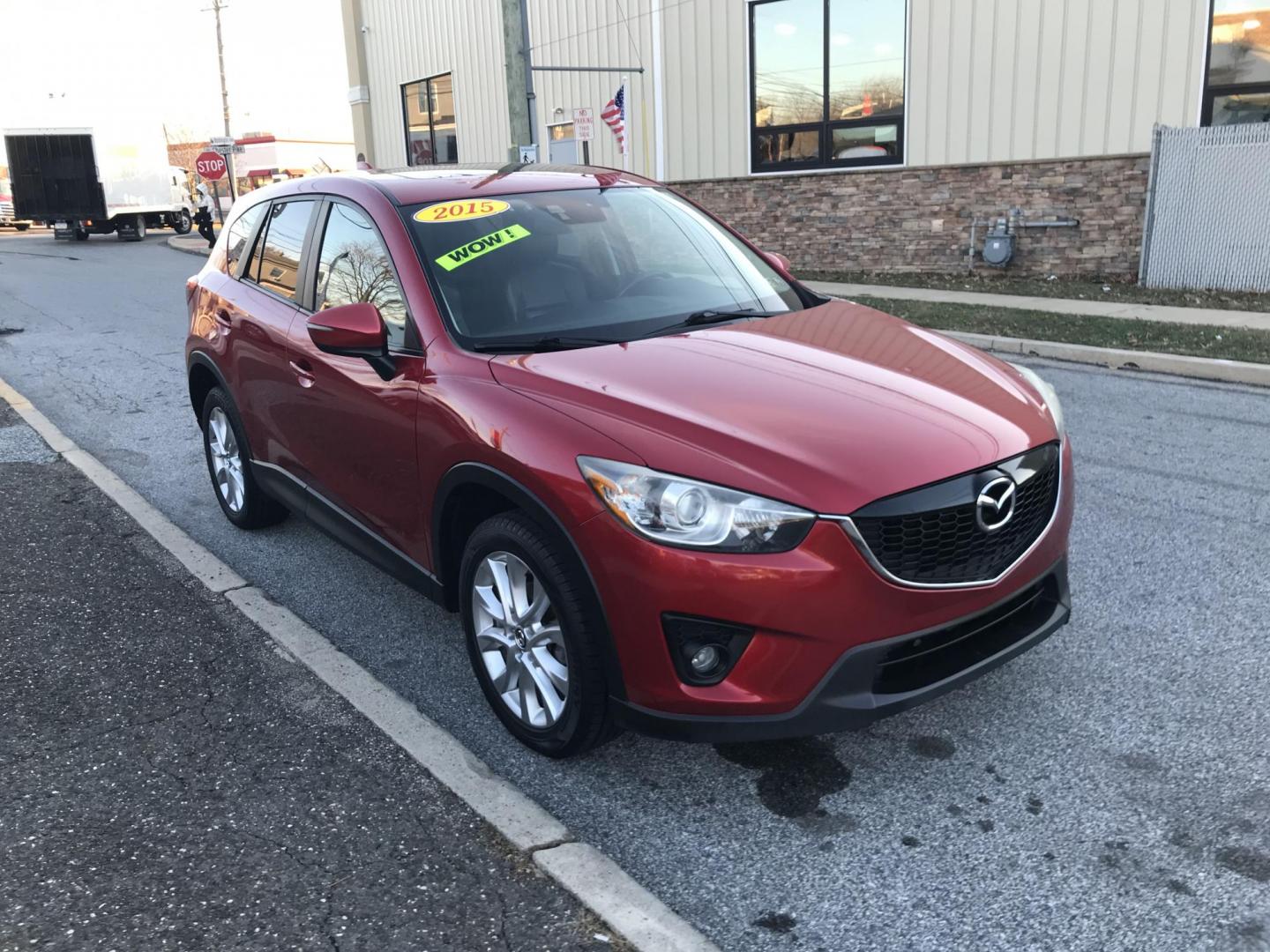 2015 Red /Black Mazda CX-5 Grand Touring AWD (JM3KE4DY2F0) with an 2.5L L4 DOHC 16V engine, 6-Speed Automatic transmission, located at 577 Chester Pike, Prospect Park, PA, 19076, (610) 237-1015, 39.886154, -75.302338 - 2015 Mazda CX-7 Grand Touring: AWD, backup camera, sunroof, new PA inspection, runs LIKE NEW! This vehicle comes inspected and has been given a bumper to bumper safety check. It is very clean, reliable, and well maintained. We offer a unique pay plan that is known for being the easiest and fastes - Photo#3