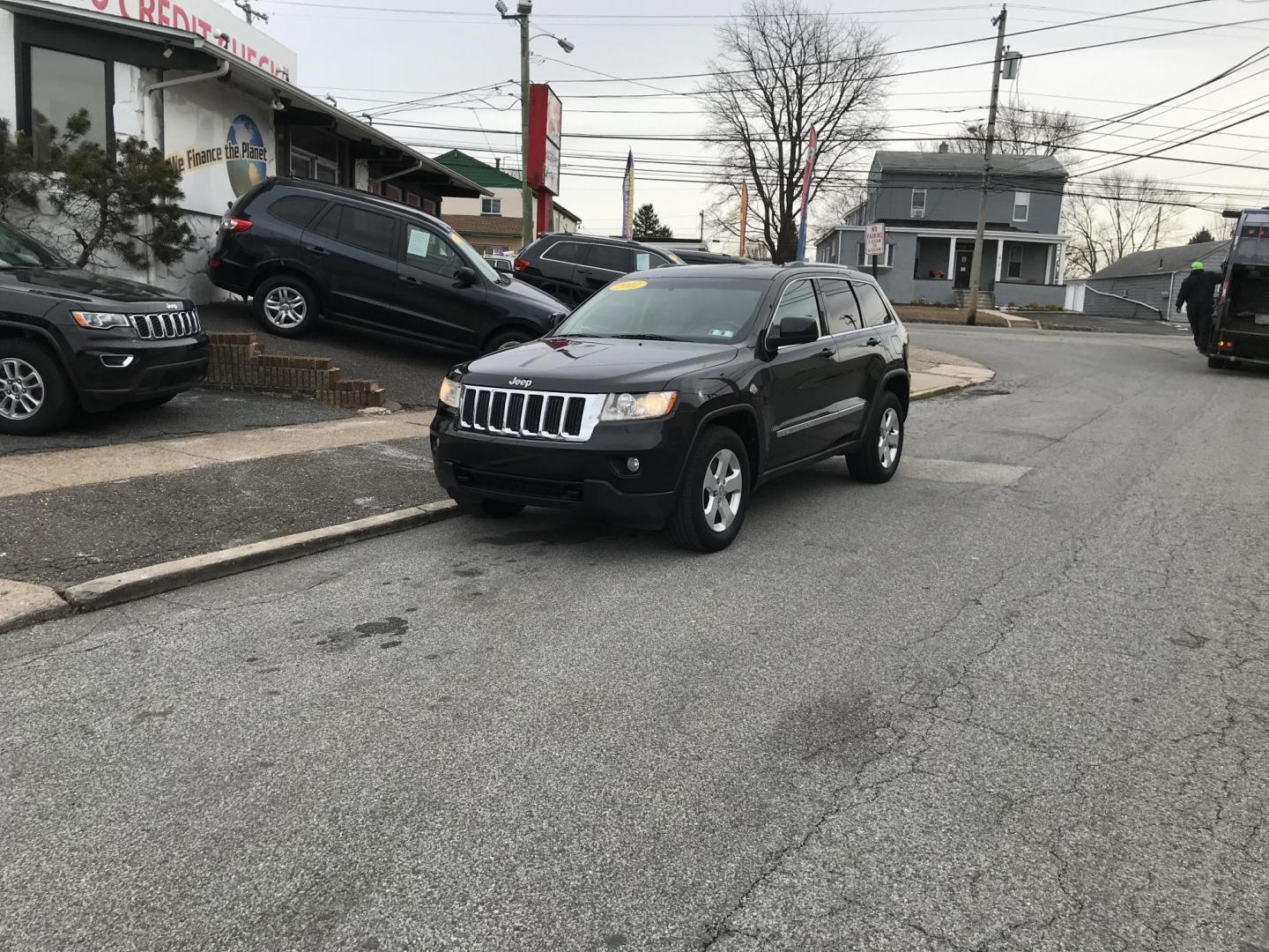 2012 Black /Tan Jeep Grand Cherokee Laredo 4WD (1C4RJFAGXCC) with an 3.6L V6 DOHC 24V engine, 5-Speed Automatic transmission, located at 577 Chester Pike, Prospect Park, PA, 19076, (610) 237-1015, 39.886154, -75.302338 - 2012 Jeep Grand Cherokee Laredo: Only 126k miles, sunroof, backup camera, new PA inspection, SUPER CLEAN, runs LIKE NEW! This vehicle comes inspected and has been given a bumper to bumper safety check. It is very clean, reliable, and well maintained. We offer a unique pay plan that is known for b - Photo#1