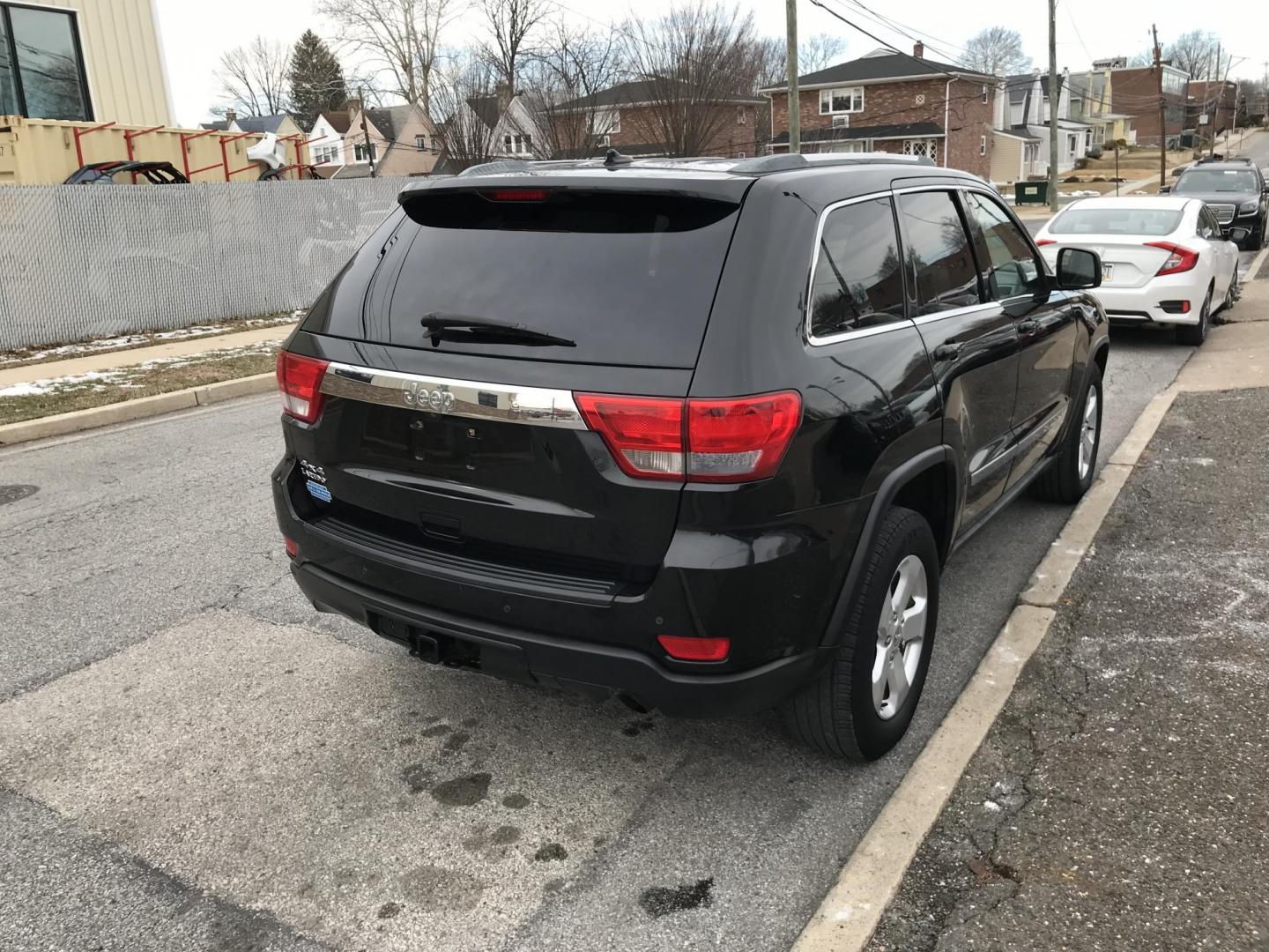 2012 Black /Tan Jeep Grand Cherokee Laredo 4WD (1C4RJFAGXCC) with an 3.6L V6 DOHC 24V engine, 5-Speed Automatic transmission, located at 577 Chester Pike, Prospect Park, PA, 19076, (610) 237-1015, 39.886154, -75.302338 - 2012 Jeep Grand Cherokee Laredo: Only 126k miles, sunroof, backup camera, new PA inspection, SUPER CLEAN, runs LIKE NEW! This vehicle comes inspected and has been given a bumper to bumper safety check. It is very clean, reliable, and well maintained. We offer a unique pay plan that is known for b - Photo#4