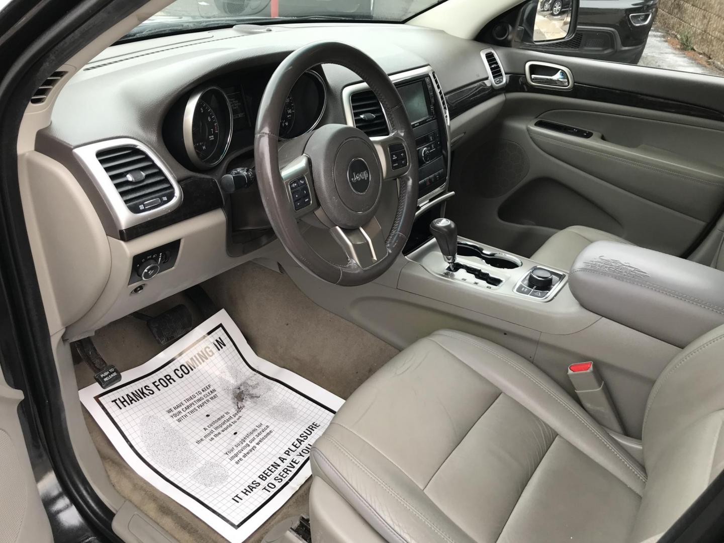 2012 Black /Tan Jeep Grand Cherokee Laredo 4WD (1C4RJFAGXCC) with an 3.6L V6 DOHC 24V engine, 5-Speed Automatic transmission, located at 577 Chester Pike, Prospect Park, PA, 19076, (610) 237-1015, 39.886154, -75.302338 - 2012 Jeep Grand Cherokee Laredo: Only 126k miles, sunroof, backup camera, new PA inspection, SUPER CLEAN, runs LIKE NEW! This vehicle comes inspected and has been given a bumper to bumper safety check. It is very clean, reliable, and well maintained. We offer a unique pay plan that is known for b - Photo#9