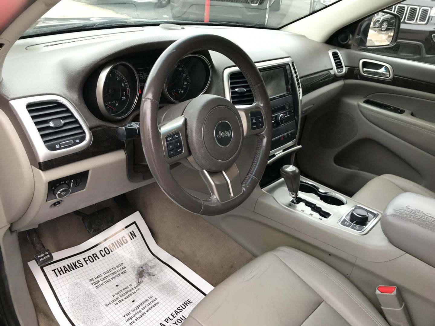 2012 Black /Tan Jeep Grand Cherokee Laredo 4WD (1C4RJFAGXCC) with an 3.6L V6 DOHC 24V engine, 5-Speed Automatic transmission, located at 577 Chester Pike, Prospect Park, PA, 19076, (610) 237-1015, 39.886154, -75.302338 - 2012 Jeep Grand Cherokee Laredo: Only 126k miles, sunroof, backup camera, new PA inspection, SUPER CLEAN, runs LIKE NEW! This vehicle comes inspected and has been given a bumper to bumper safety check. It is very clean, reliable, and well maintained. We offer a unique pay plan that is known for b - Photo#12