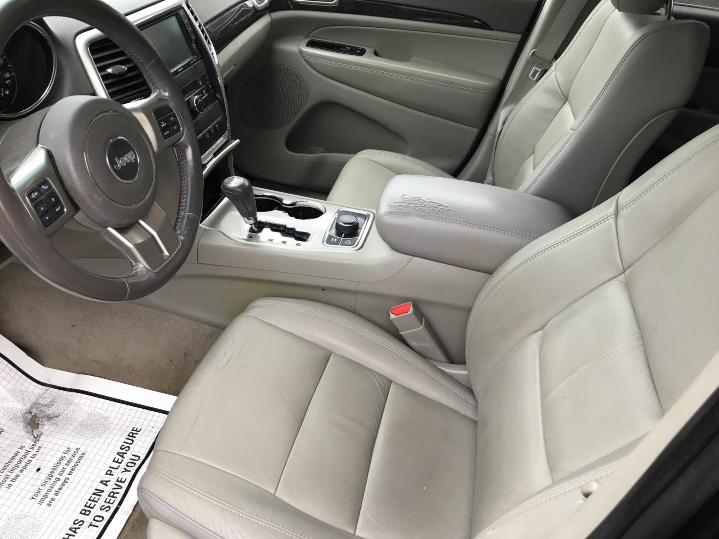 2012 Black /Tan Jeep Grand Cherokee Laredo 4WD (1C4RJFAGXCC) with an 3.6L V6 DOHC 24V engine, 5-Speed Automatic transmission, located at 577 Chester Pike, Prospect Park, PA, 19076, (610) 237-1015, 39.886154, -75.302338 - 2012 Jeep Grand Cherokee Laredo: Only 126k miles, sunroof, backup camera, new PA inspection, SUPER CLEAN, runs LIKE NEW! This vehicle comes inspected and has been given a bumper to bumper safety check. It is very clean, reliable, and well maintained. We offer a unique pay plan that is known for b - Photo#11