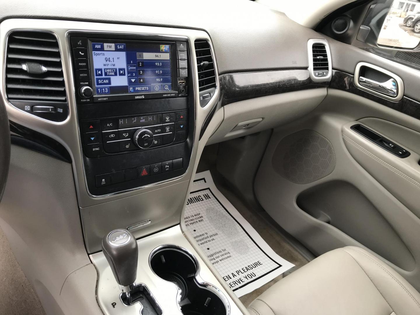 2012 Black /Tan Jeep Grand Cherokee Laredo 4WD (1C4RJFAGXCC) with an 3.6L V6 DOHC 24V engine, 5-Speed Automatic transmission, located at 577 Chester Pike, Prospect Park, PA, 19076, (610) 237-1015, 39.886154, -75.302338 - 2012 Jeep Grand Cherokee Laredo: Only 126k miles, sunroof, backup camera, new PA inspection, SUPER CLEAN, runs LIKE NEW! This vehicle comes inspected and has been given a bumper to bumper safety check. It is very clean, reliable, and well maintained. We offer a unique pay plan that is known for b - Photo#14