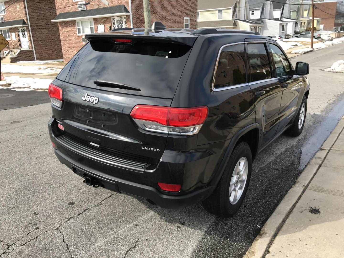 2014 Black /Black Jeep Grand Cherokee Laredo 4WD (1C4RJFAG6EC) with an 3.6L V6 DOHC 24V engine, 5-Speed Automatic transmission, located at 577 Chester Pike, Prospect Park, PA, 19076, (610) 237-1015, 39.886154, -75.302338 - 2014 Jeep Grand Cherokee Laredo: Sunroof, 4x4, backup camera, new PA inspection, SUPER CLEAN, runs LIKE NEW! This vehicle comes inspected and has been given a bumper to bumper safety check. It is very clean, reliable, and well maintained. We offer a unique pay plan that is known for being the eas - Photo#4