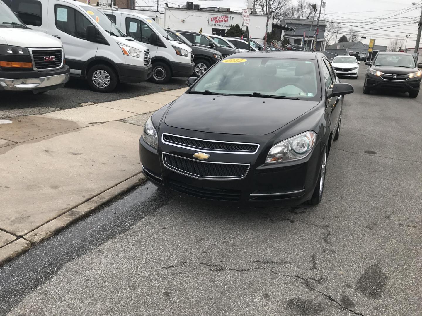2012 Black /Gray Chevrolet Malibu 1LT (1G1ZC5E0XCF) with an 2.4L L4 DOHC 16V engine, 6-Speed Automatic transmission, located at 577 Chester Pike, Prospect Park, PA, 19076, (610) 237-1015, 39.886154, -75.302338 - Photo#2