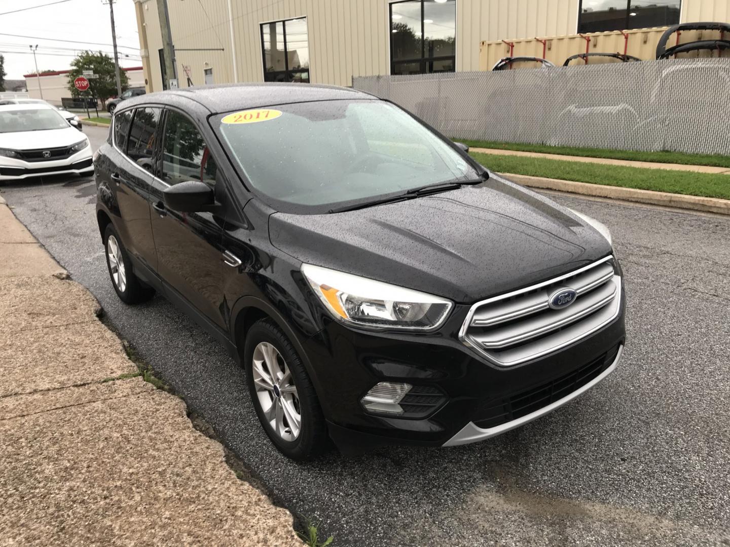 2017 Black /Black Ford Escape SE 4WD (1FMCU9G91HU) with an 2.0L L4 DOHC 16V engine, 6A transmission, located at 577 Chester Pike, Prospect Park, PA, 19076, (610) 237-1015, 39.886154, -75.302338 - 2017 Ford Escape SE: Great on gas, 4x4, backup camera, SUPER CLEAN, runs LIKE NEW! This vehicle comes inspected and has been given a bumper to bumper safety check. It is very clean, reliable, and well maintained. We offer a unique pay plan that is known for being the easiest and fastest financing- Photo#3