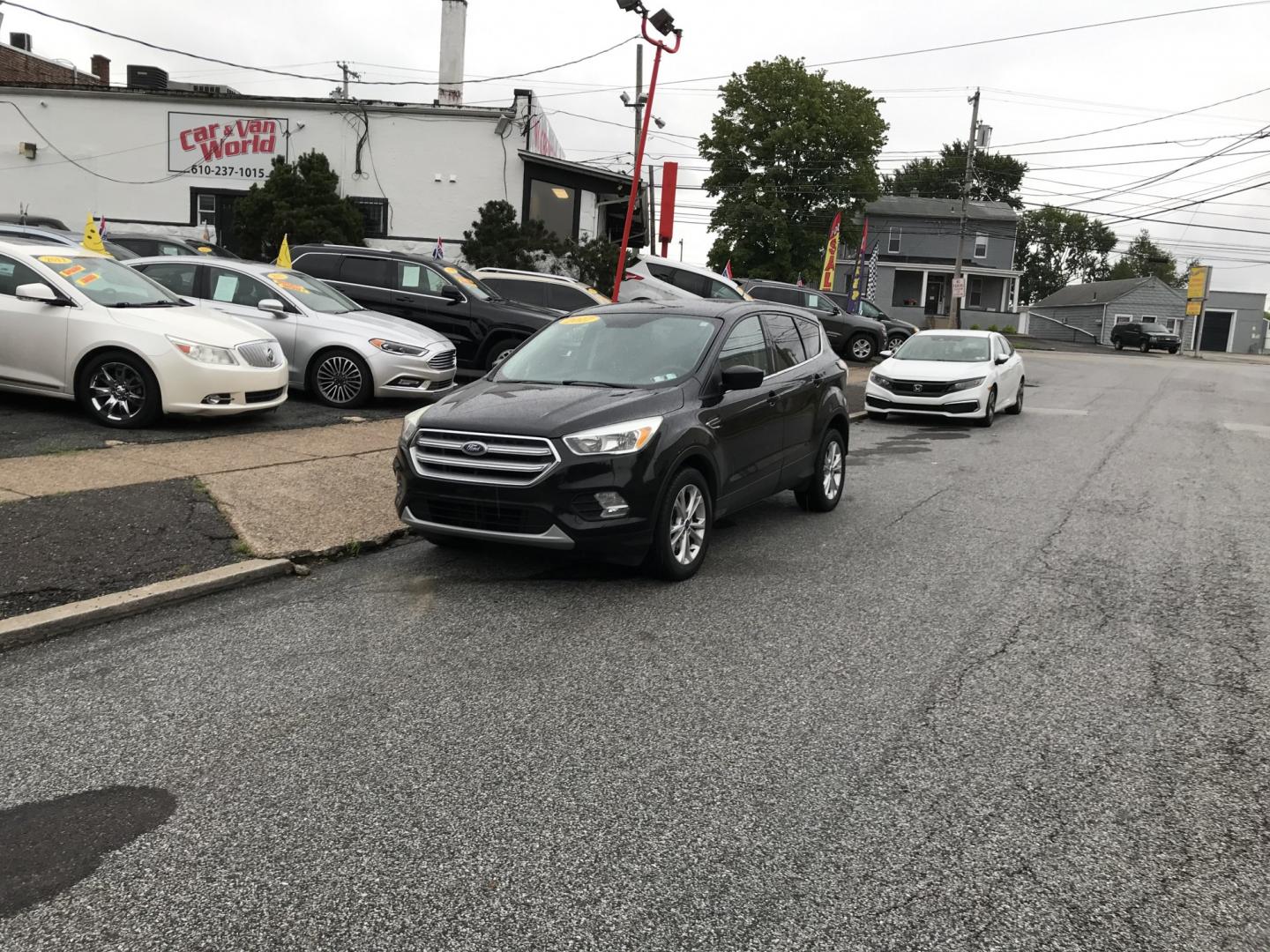 2017 Black /Black Ford Escape SE 4WD (1FMCU9G91HU) with an 2.0L L4 DOHC 16V engine, 6A transmission, located at 577 Chester Pike, Prospect Park, PA, 19076, (610) 237-1015, 39.886154, -75.302338 - 2017 Ford Escape SE: Great on gas, 4x4, backup camera, SUPER CLEAN, runs LIKE NEW! This vehicle comes inspected and has been given a bumper to bumper safety check. It is very clean, reliable, and well maintained. We offer a unique pay plan that is known for being the easiest and fastest financing- Photo#1