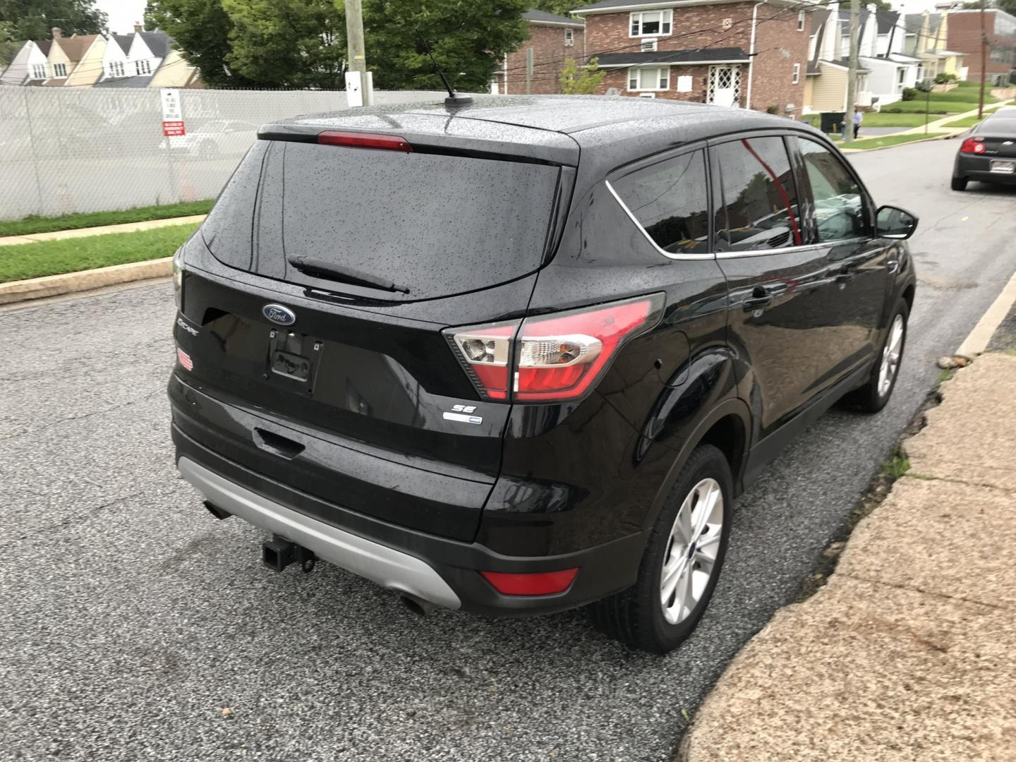 2017 Black /Black Ford Escape SE 4WD (1FMCU9G91HU) with an 2.0L L4 DOHC 16V engine, 6A transmission, located at 577 Chester Pike, Prospect Park, PA, 19076, (610) 237-1015, 39.886154, -75.302338 - 2017 Ford Escape SE: Great on gas, 4x4, backup camera, SUPER CLEAN, runs LIKE NEW! This vehicle comes inspected and has been given a bumper to bumper safety check. It is very clean, reliable, and well maintained. We offer a unique pay plan that is known for being the easiest and fastest financing- Photo#4