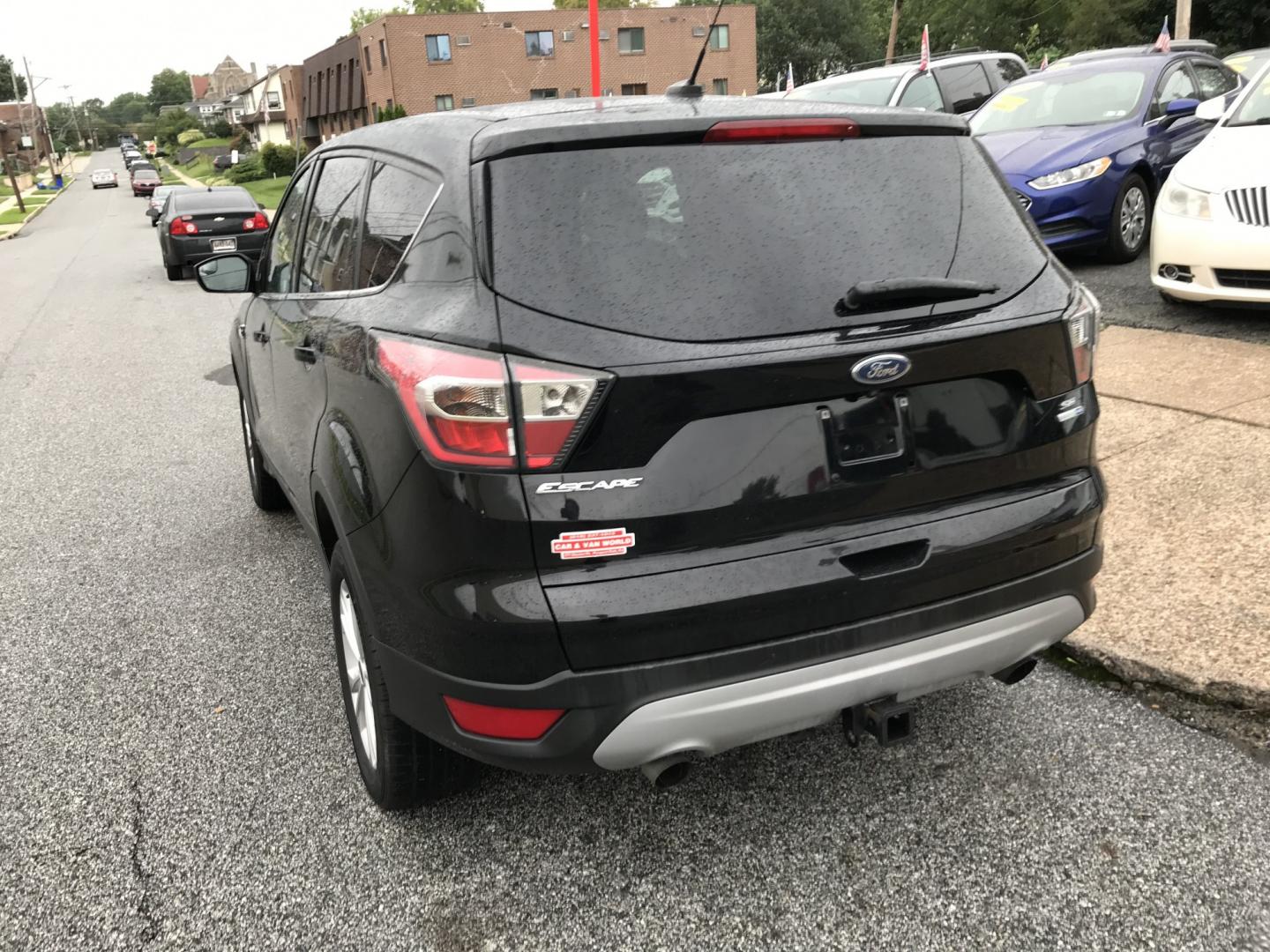 2017 Black /Black Ford Escape SE 4WD (1FMCU9G91HU) with an 2.0L L4 DOHC 16V engine, 6A transmission, located at 577 Chester Pike, Prospect Park, PA, 19076, (610) 237-1015, 39.886154, -75.302338 - 2017 Ford Escape SE: Great on gas, 4x4, backup camera, SUPER CLEAN, runs LIKE NEW! This vehicle comes inspected and has been given a bumper to bumper safety check. It is very clean, reliable, and well maintained. We offer a unique pay plan that is known for being the easiest and fastest financing- Photo#5